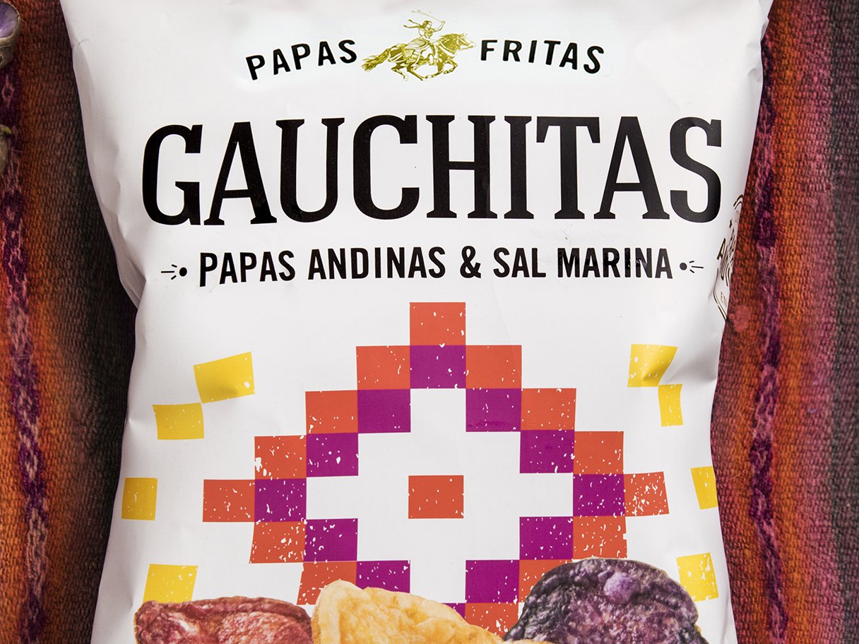 Rooftops of a coastal town with the sea in background