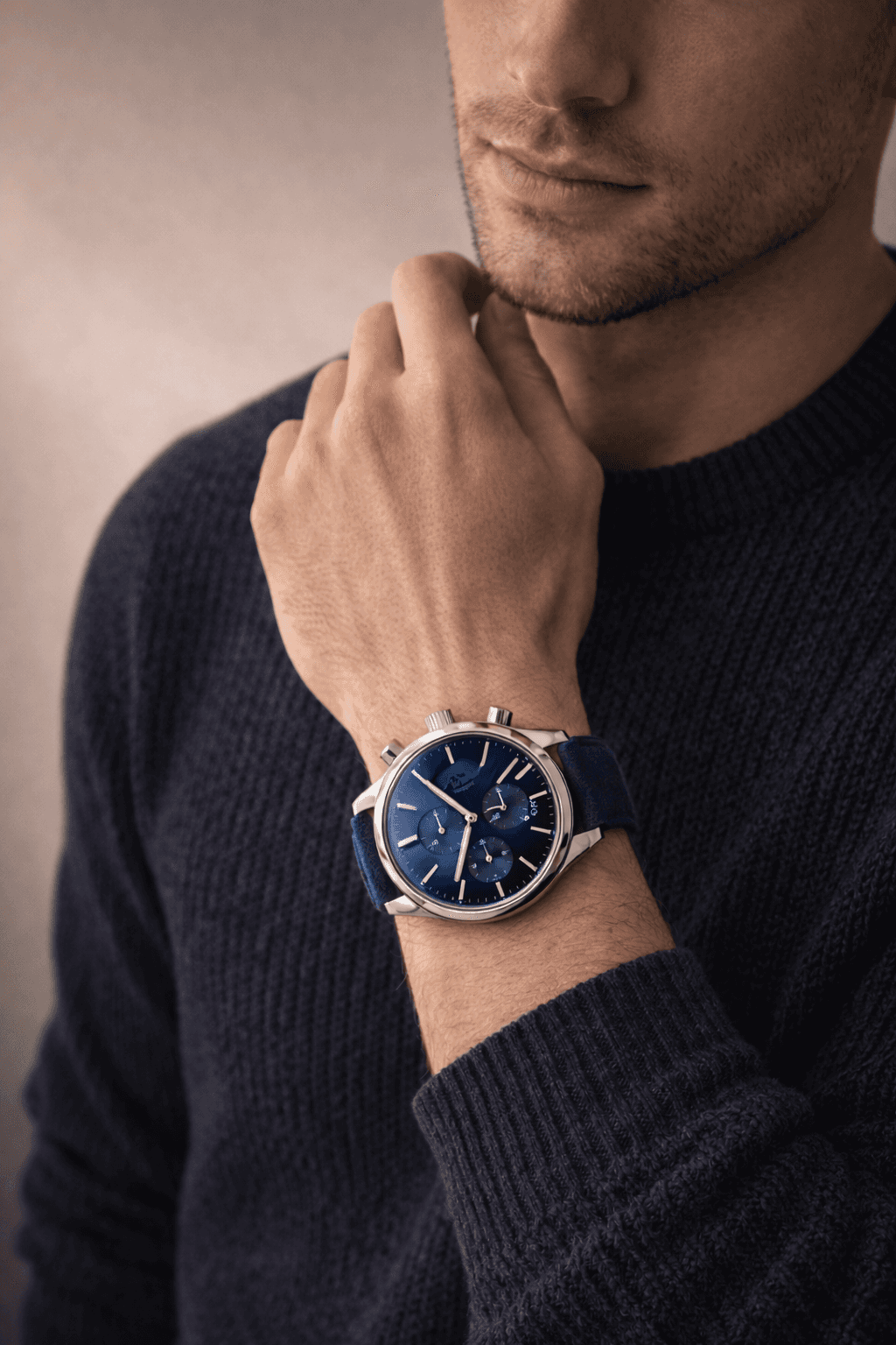 blue ALTURA on a man's wrist with warm background