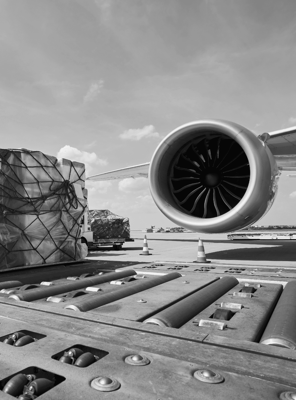 Cargo being lifted into a large cargo aircraft