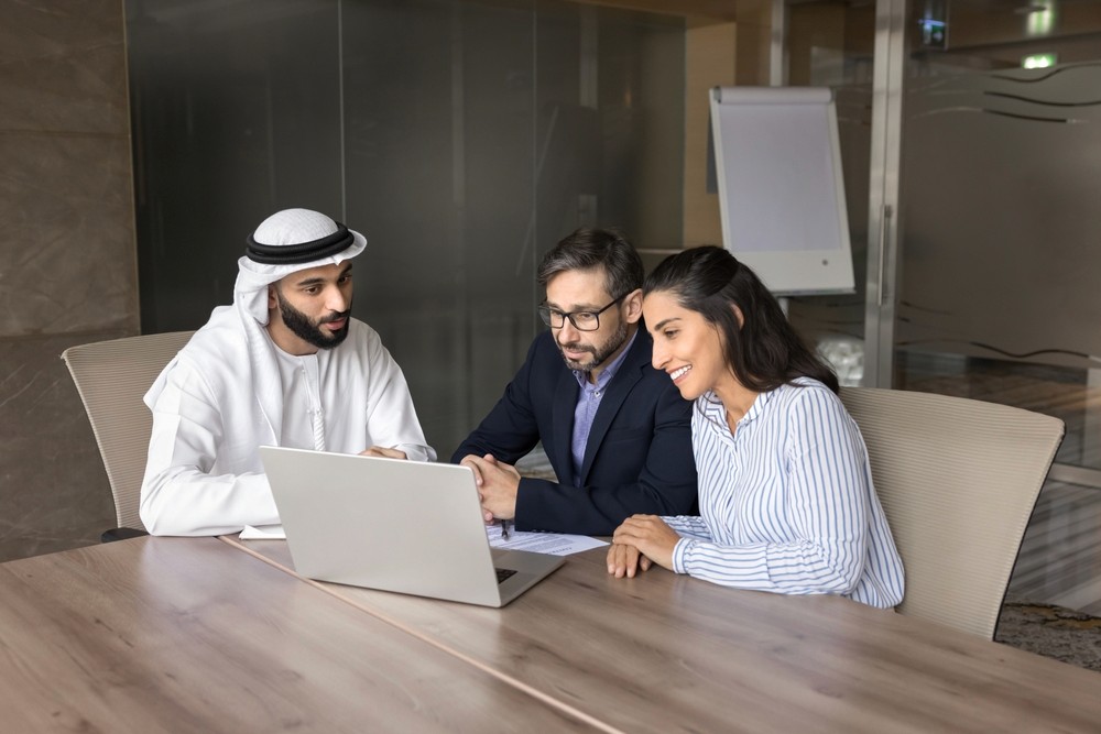 A woman smiling sitting in the office