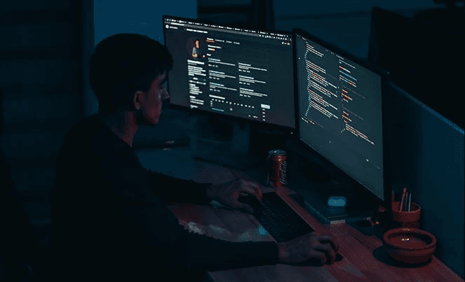 Person working hard on the computer manging IT