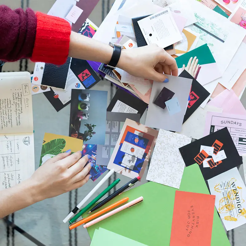 brand designer shuffling through inspiration