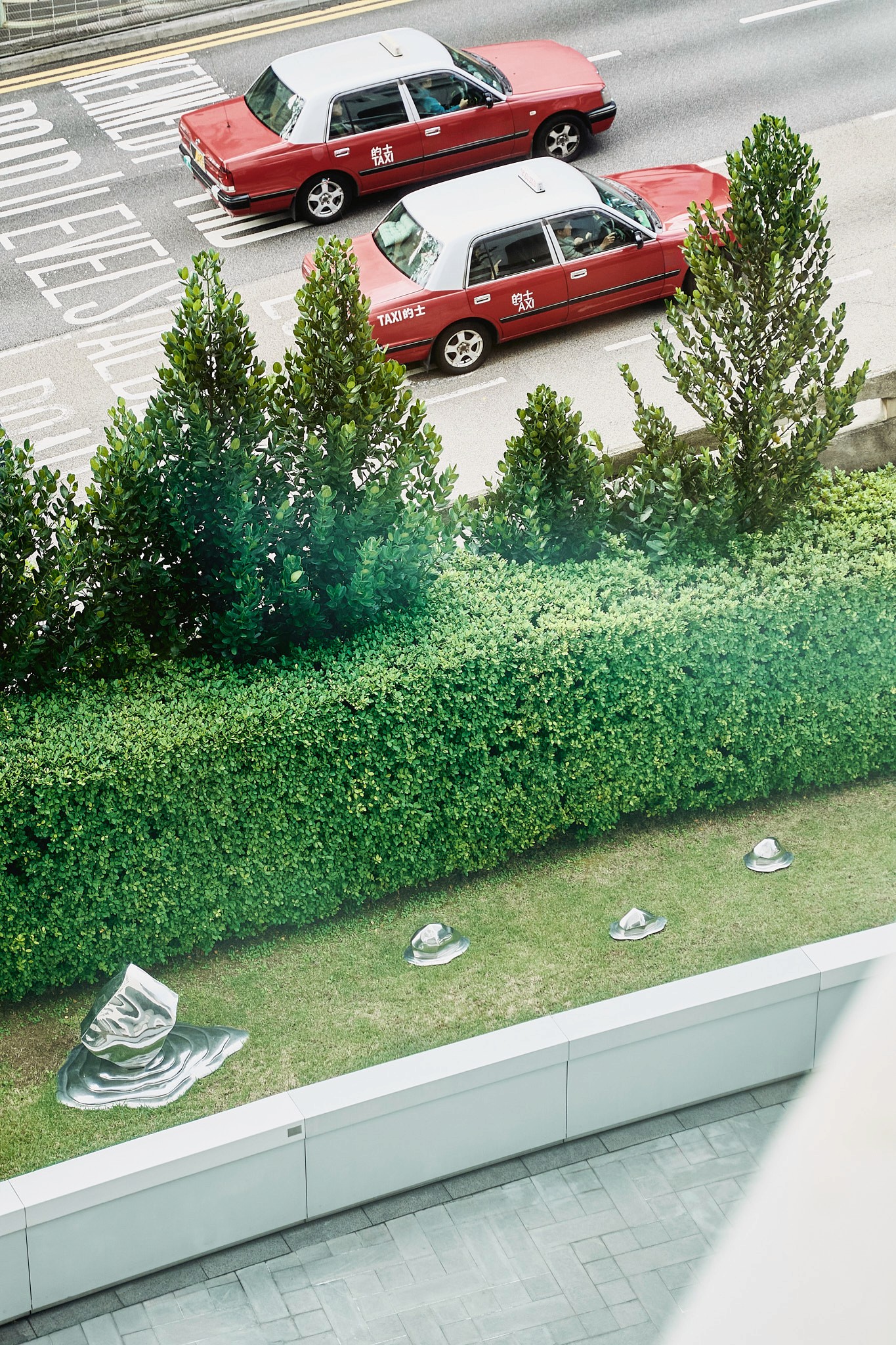 Cinematic image of hands preparing clay in rays of sunlight.