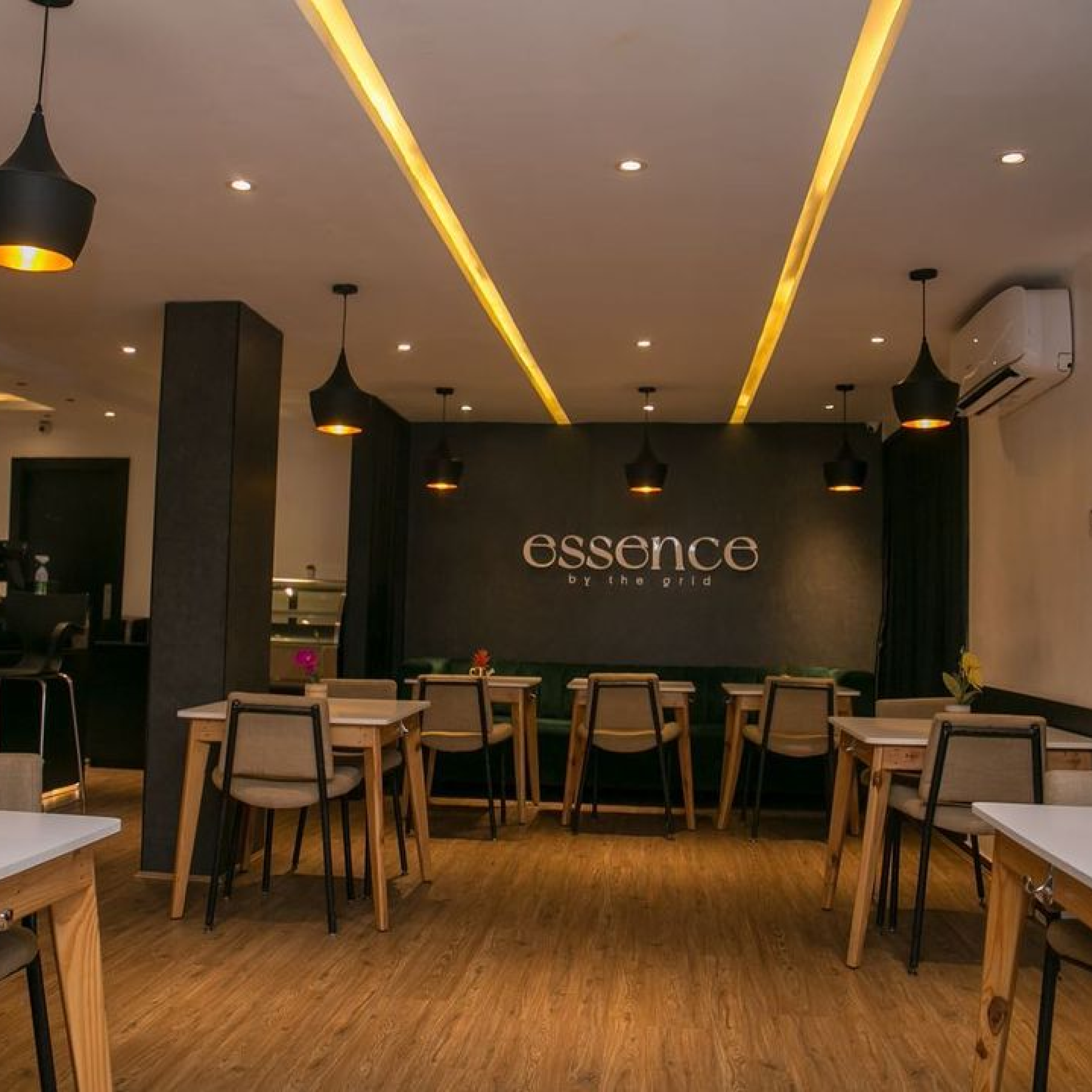 Bright orange drawstring fabric bag tied at the top, printed with a bold black smiley face and the text “Smiley Co” above it against an orange background.