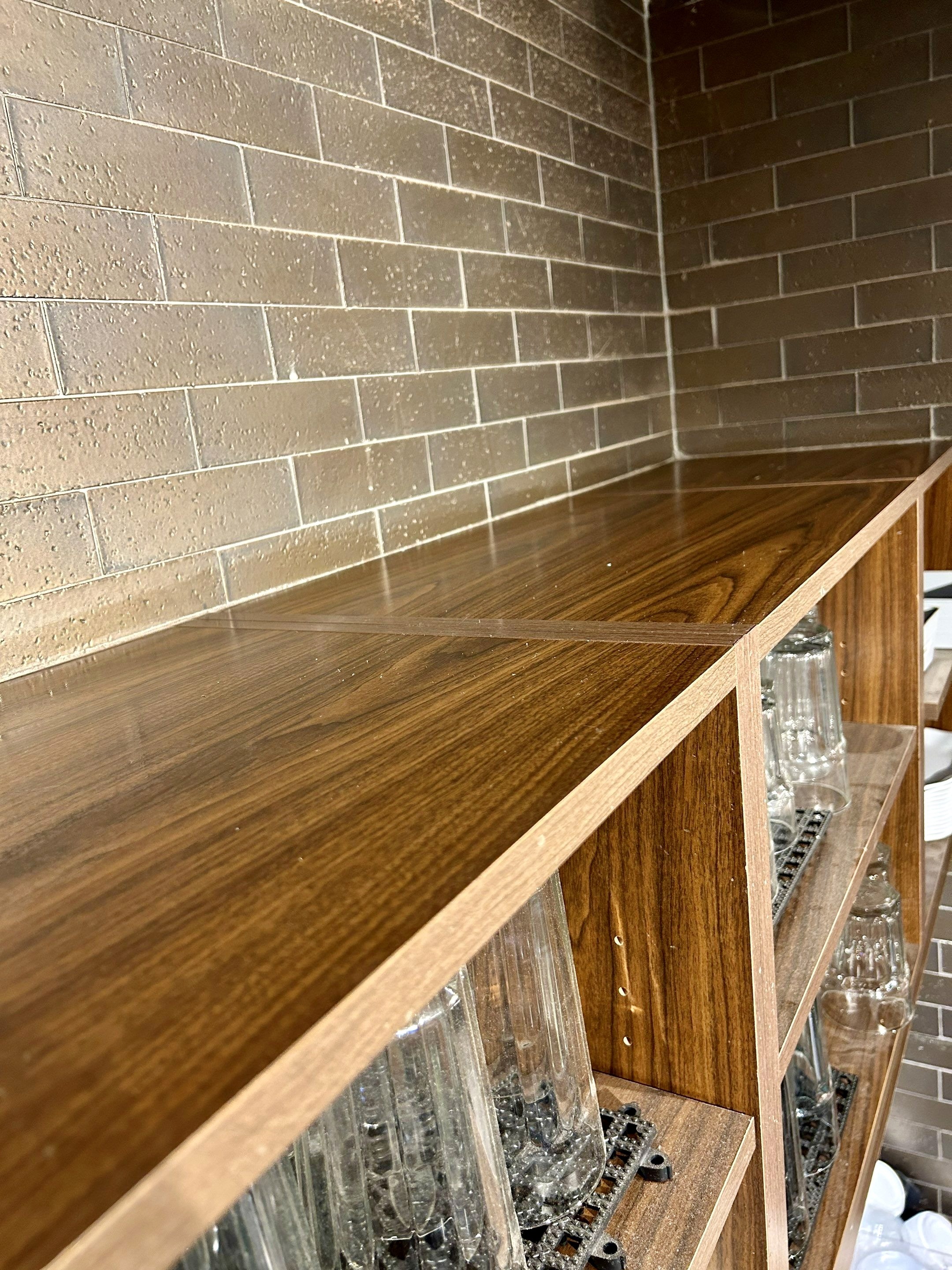Shelving fully cleaned and polished, removing debris and buildup.