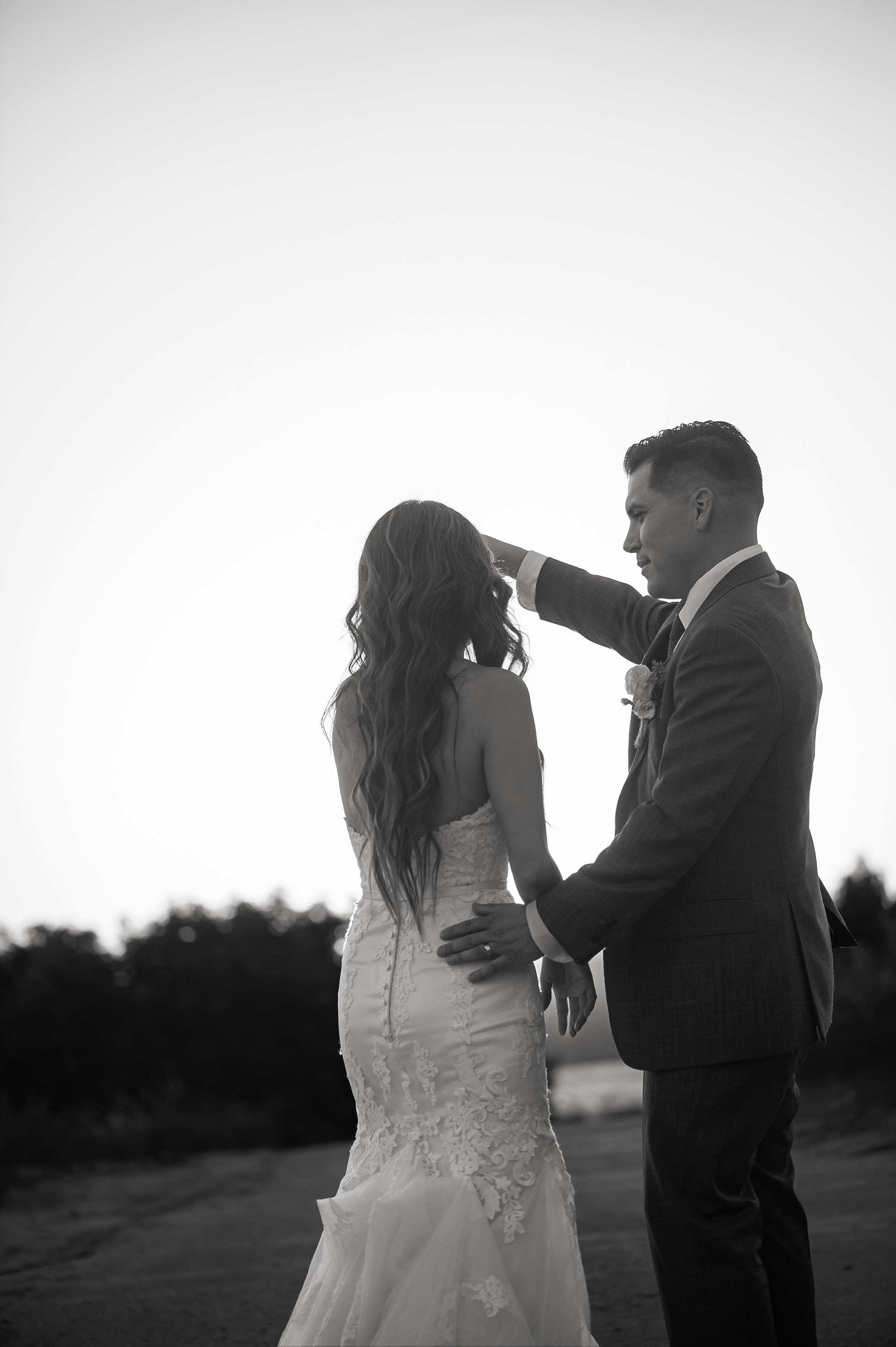 Flat lay wedding details with bouquet, rings, and sparkling bridal heels