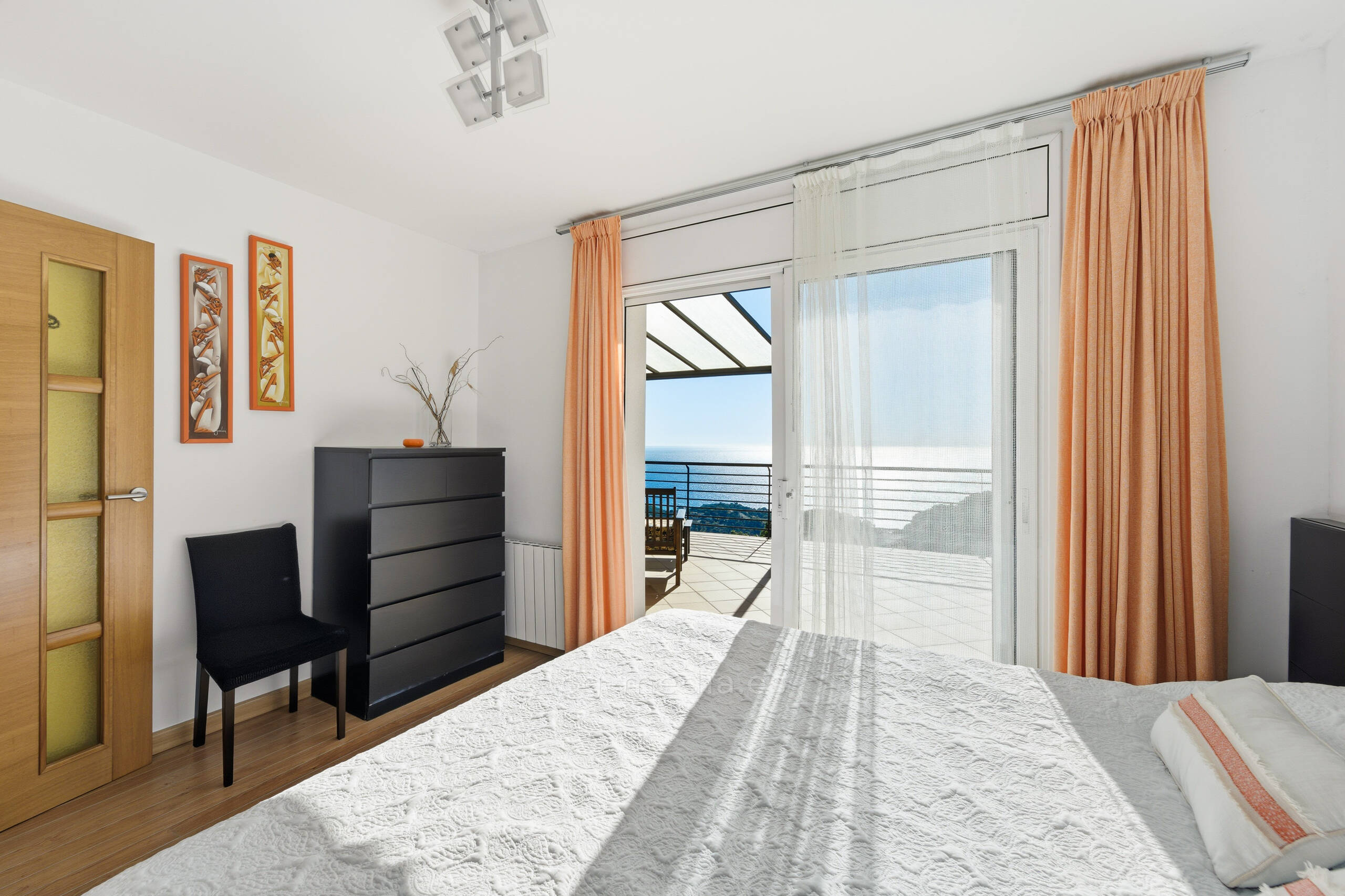 A black and white photo of a woman smiling