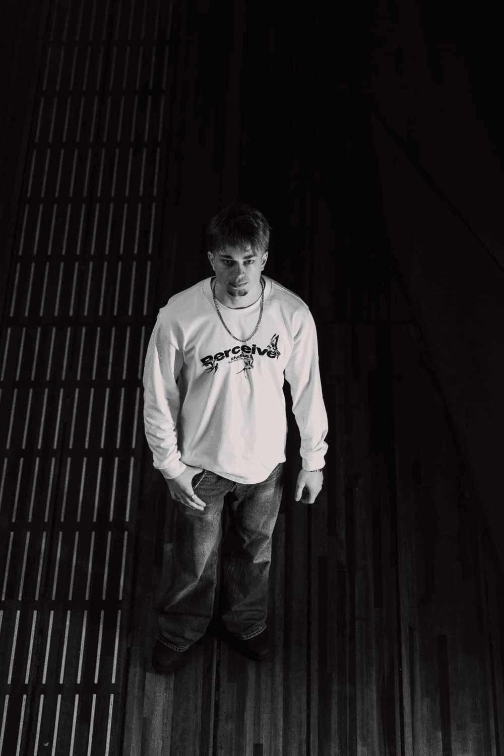 a blurry photo of a person standing in front of a wall