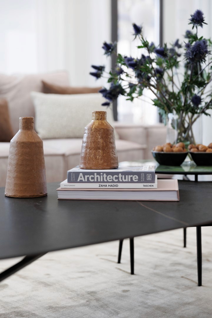 Villa Trio styled coffee table vignette with an Architecture book and floral arrangement