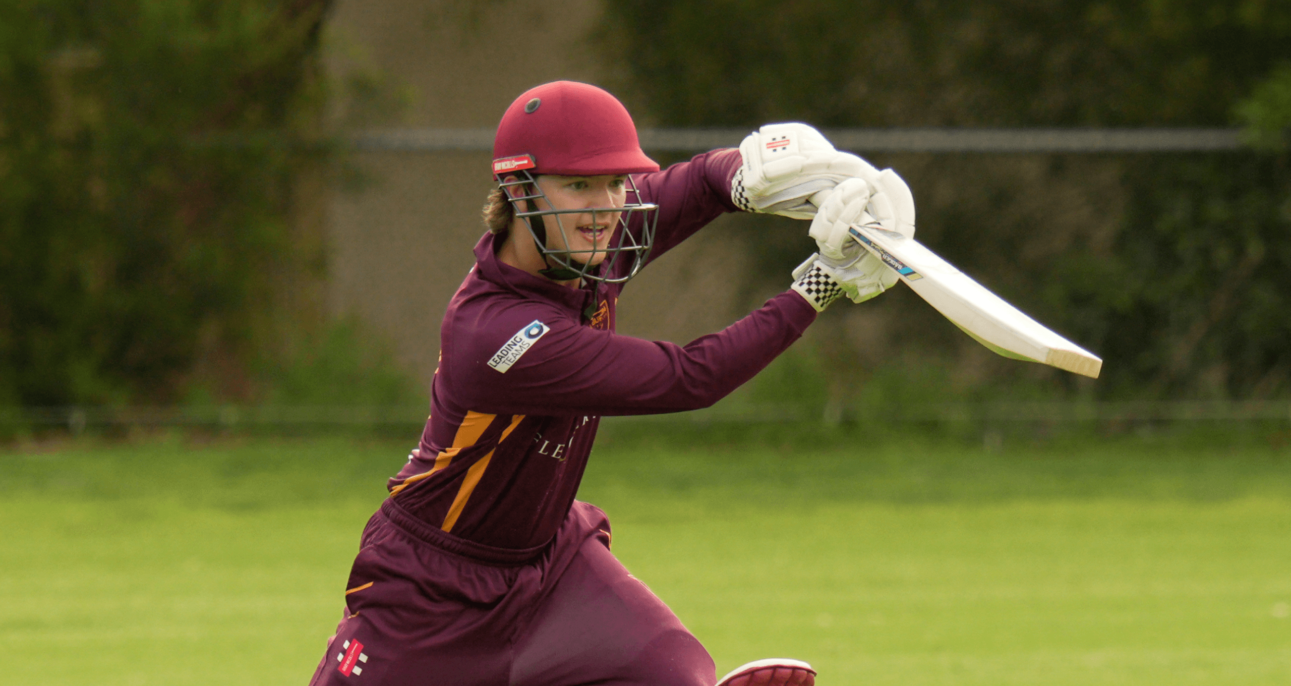 Batsman playing a cricket drive shot