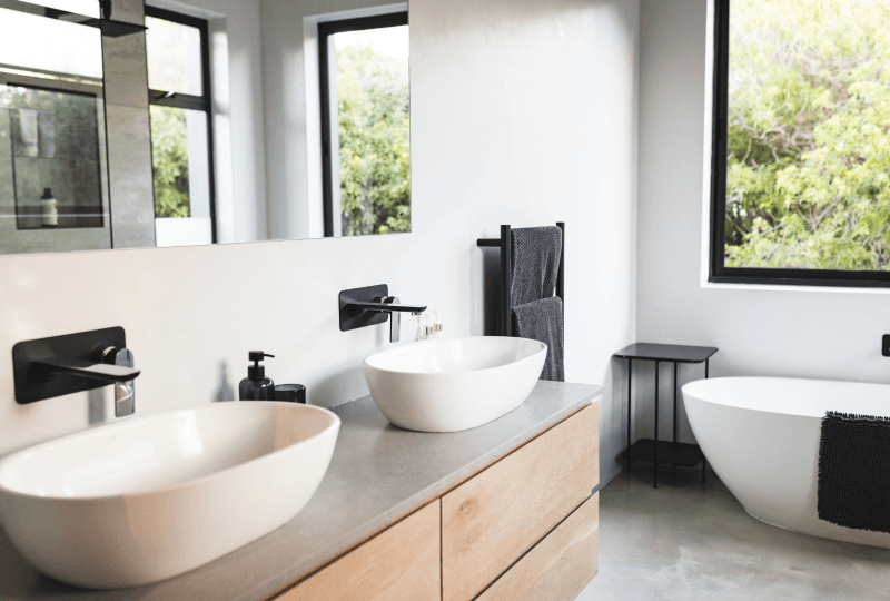 a bathroom with a toilet, sink, and bathtub