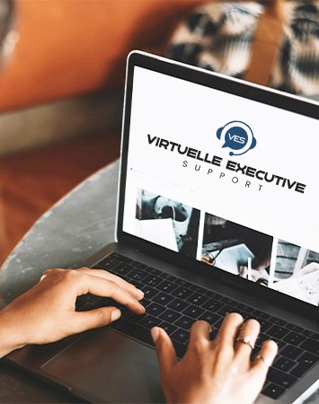 Asian women gathered together, smiling for a photo, showcasing teamwork at Virtuelle Executive Services.