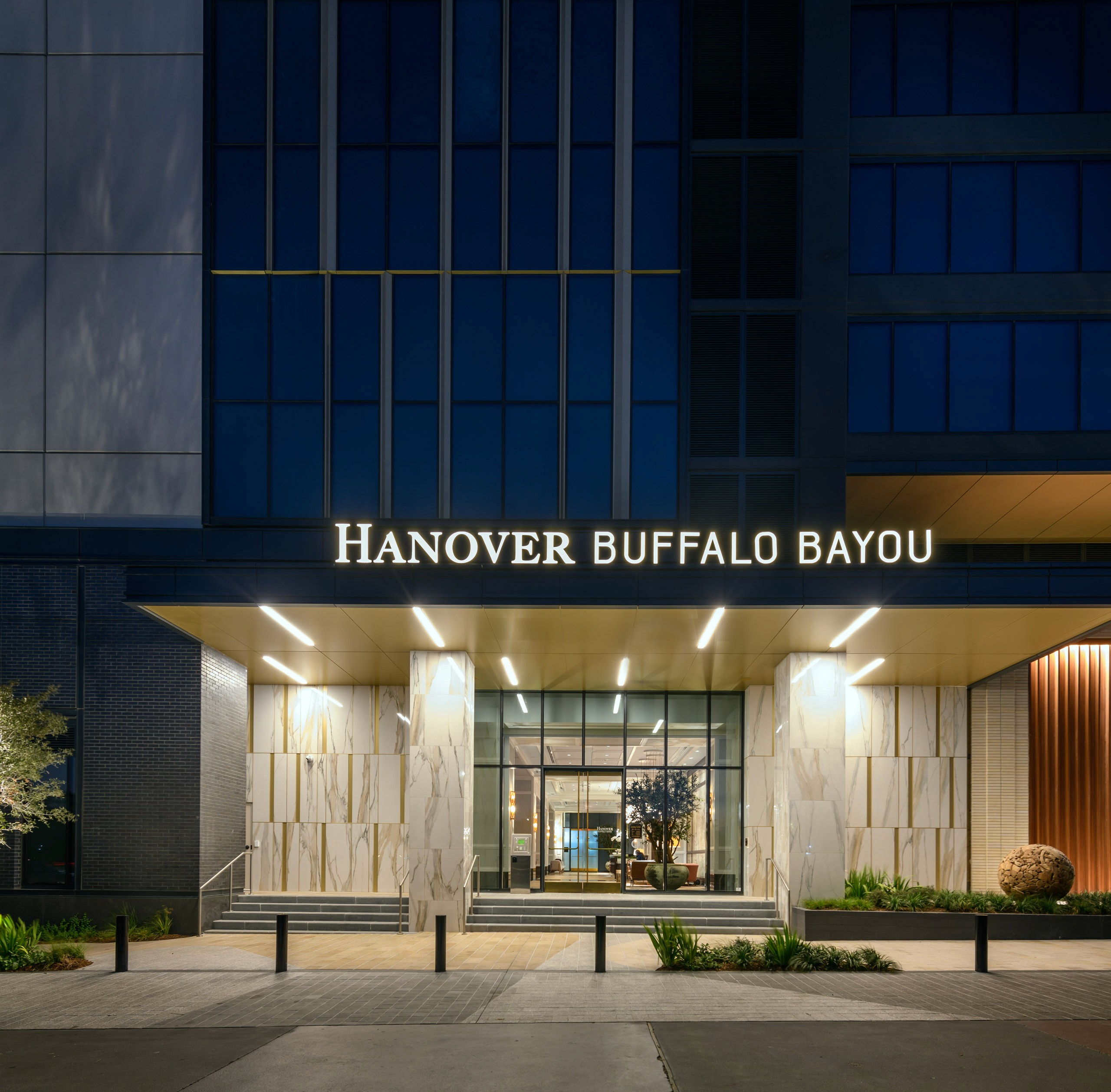 "Hanover Buffalo Bayou" sign on building entrance