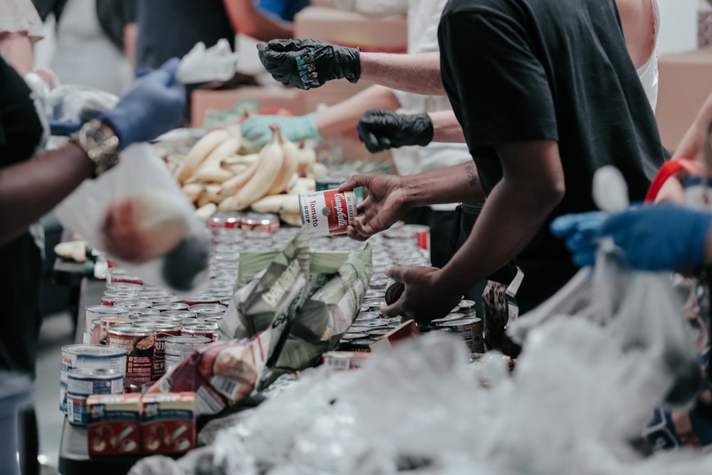 Hands sorting donated food
