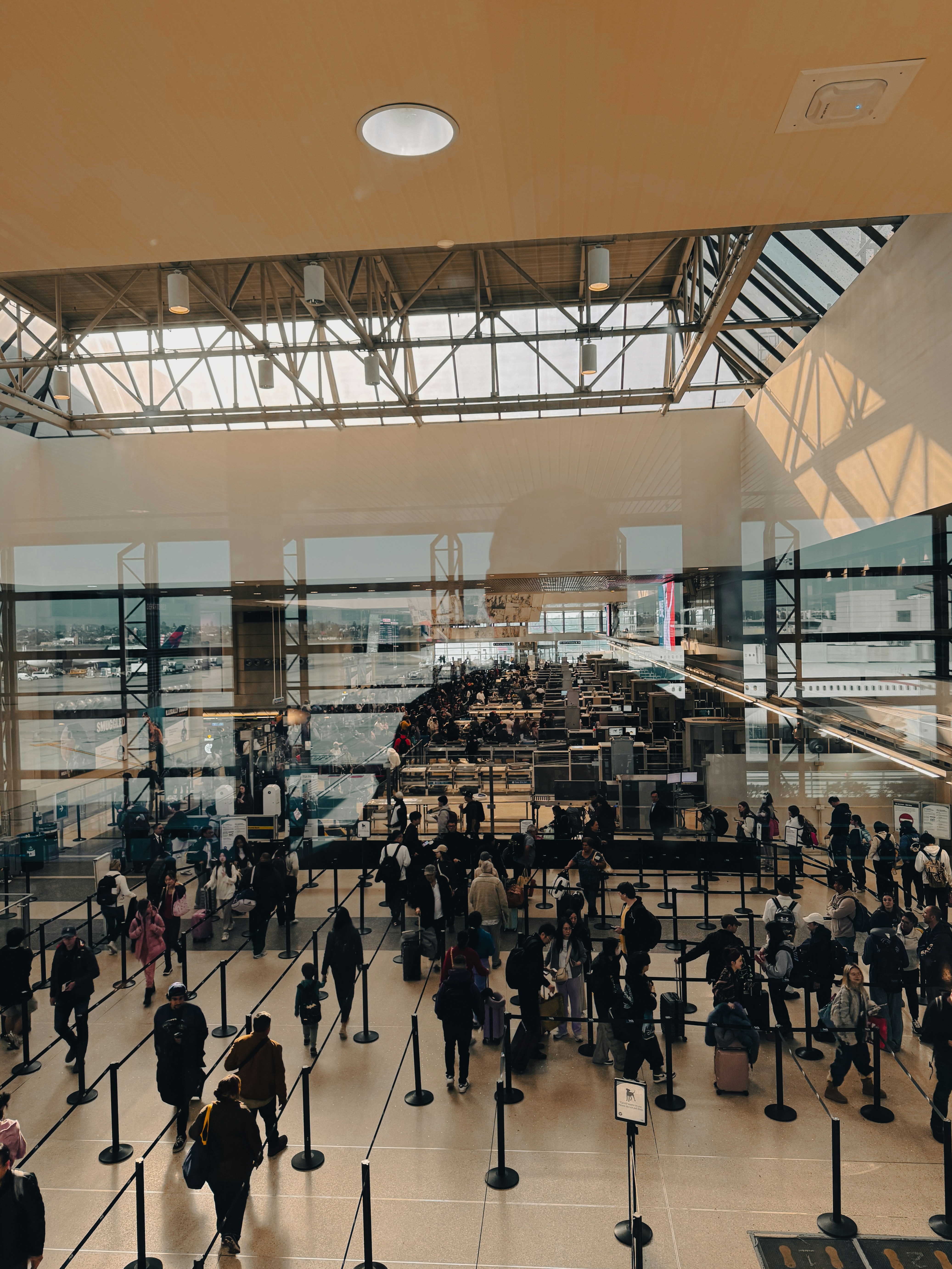 A large group of people walking around a building