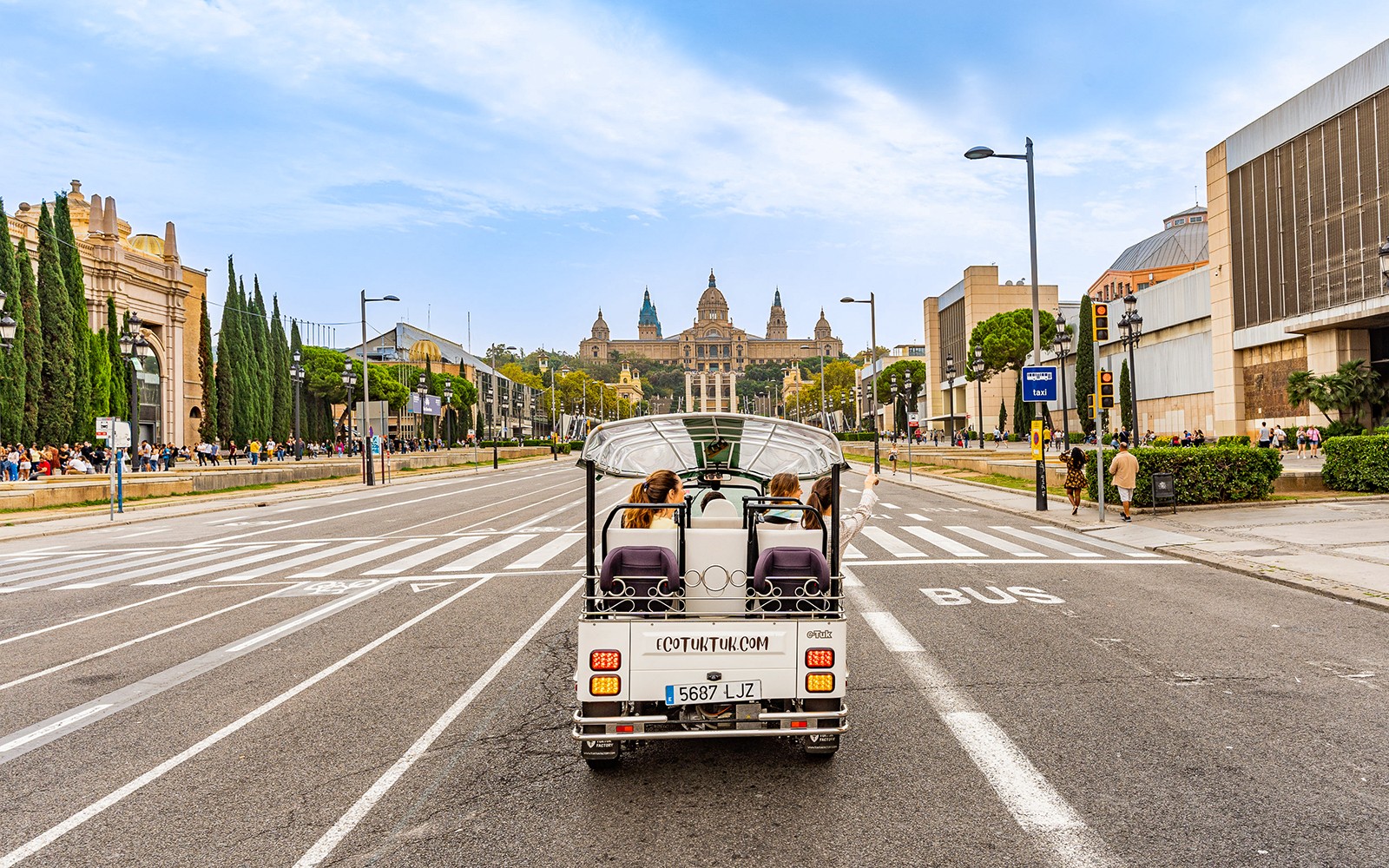 Tuk tuk tour passing by Sagrada Familia in Barcelona.