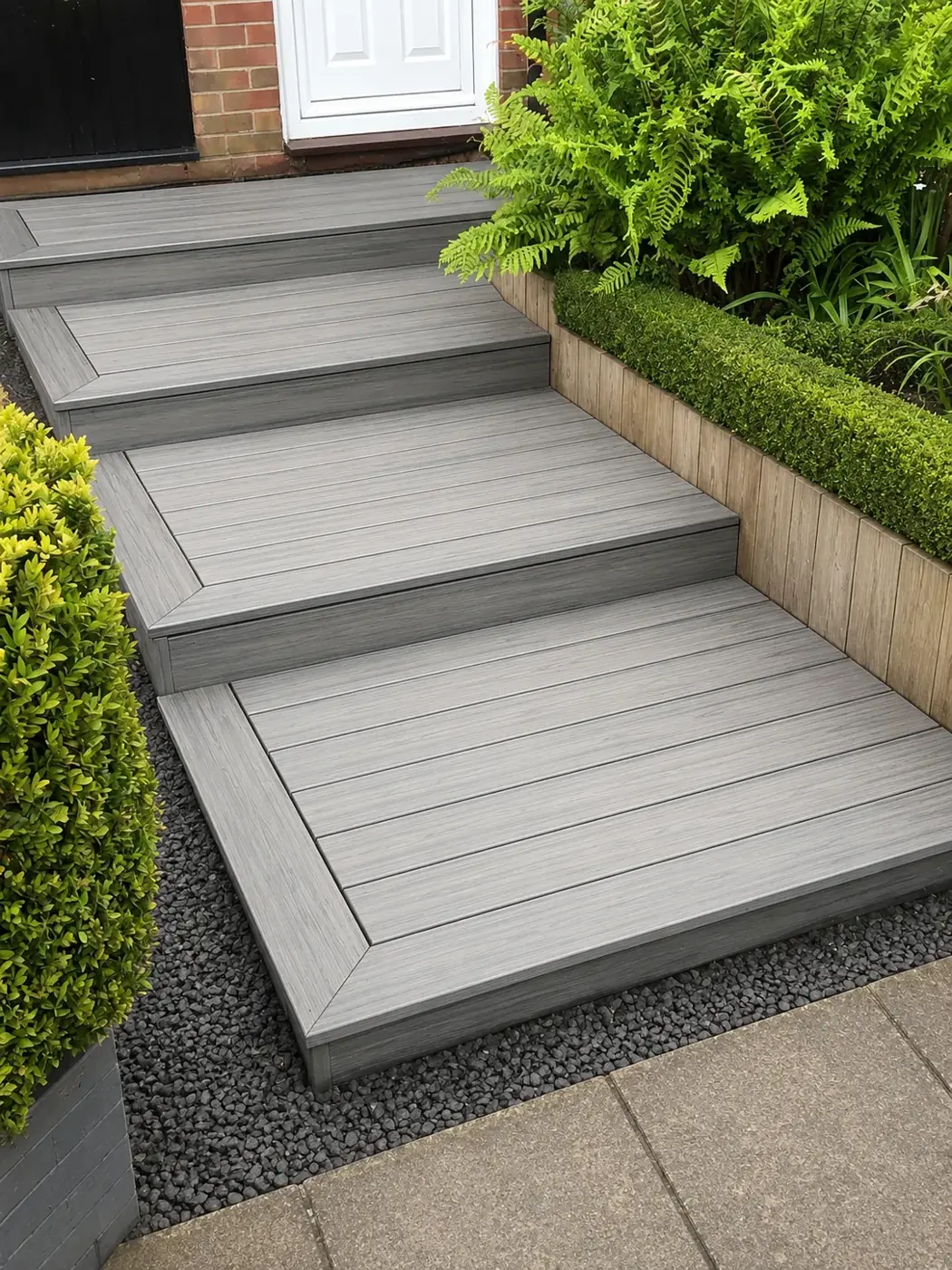 Grey Trex composite steps to a front door