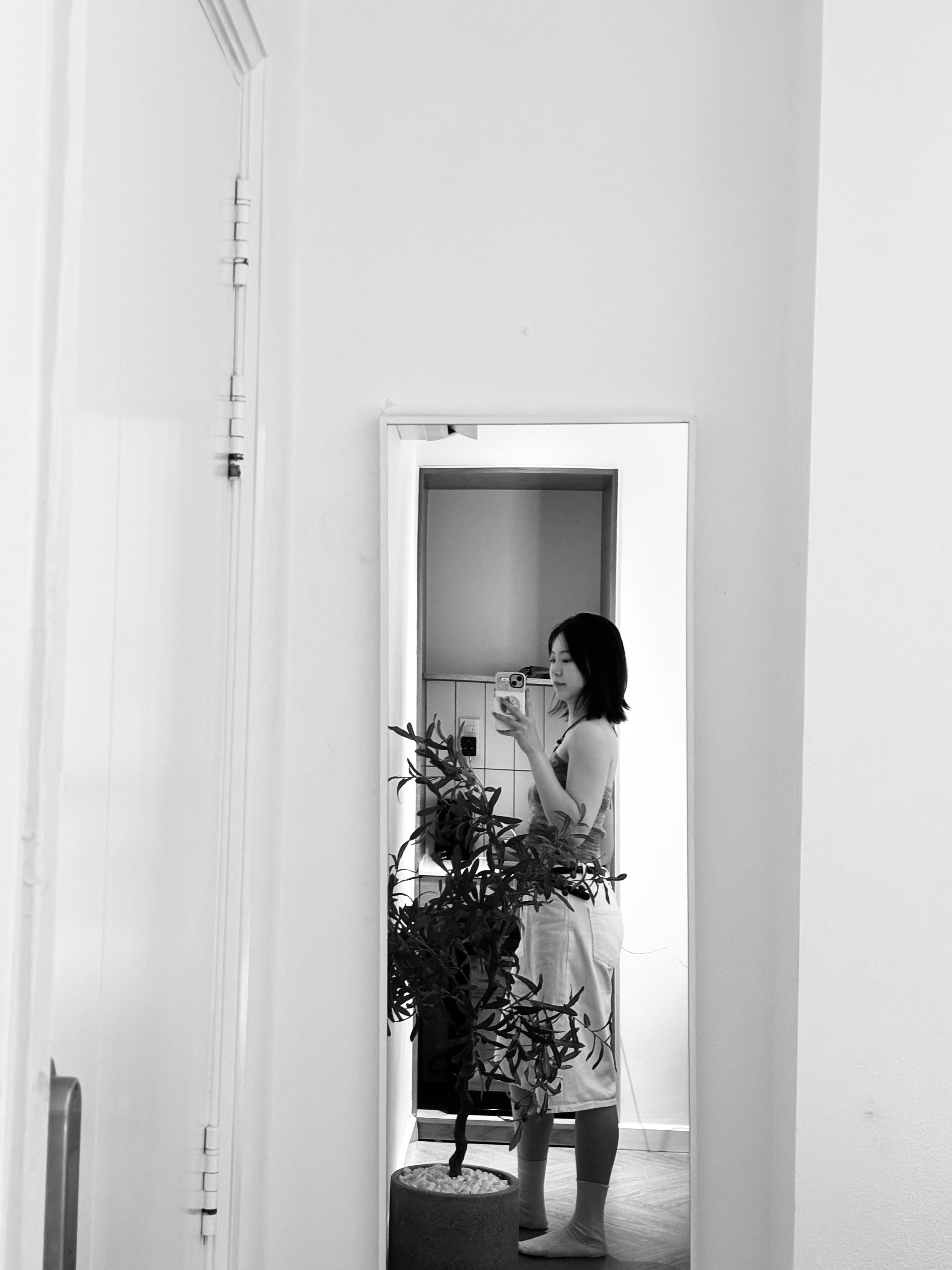 a blurry photo of a person standing in front of a wall