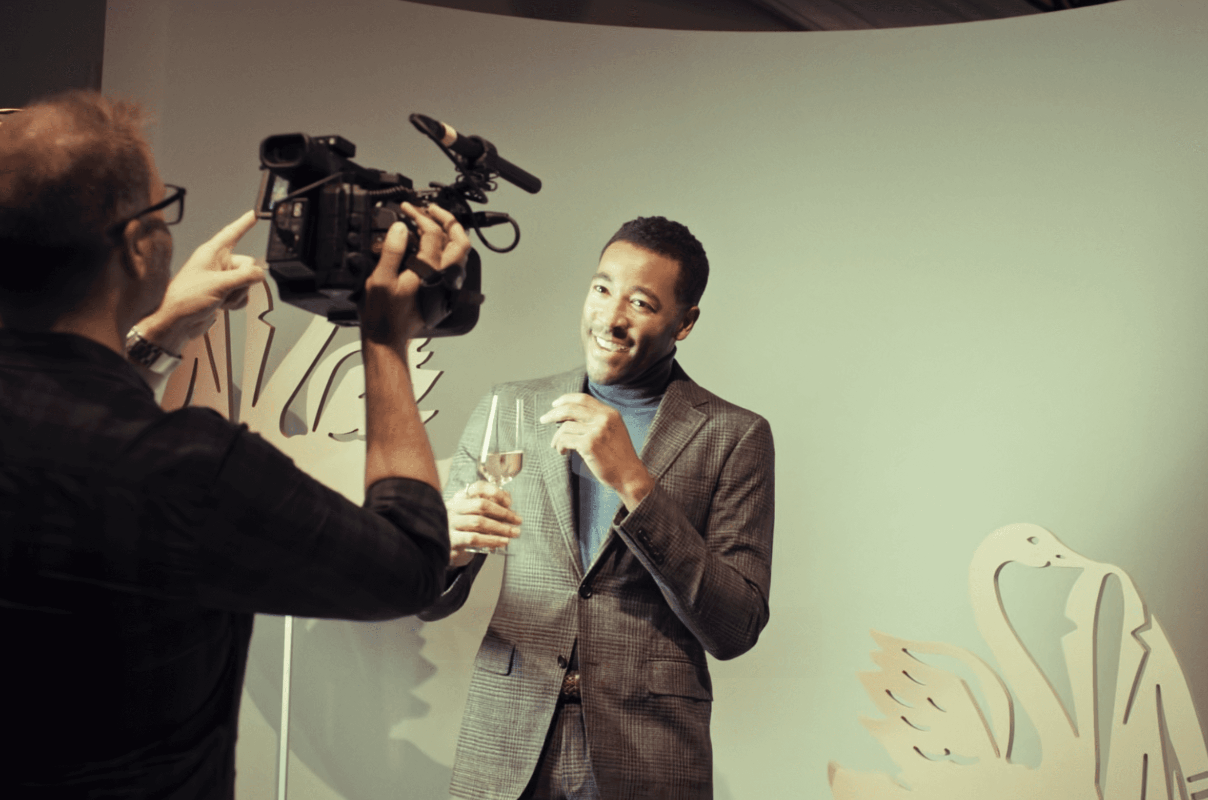 Event video production services NYC - Raised Media Co.black and white photo of a person in motion captured in soft blur on white background.