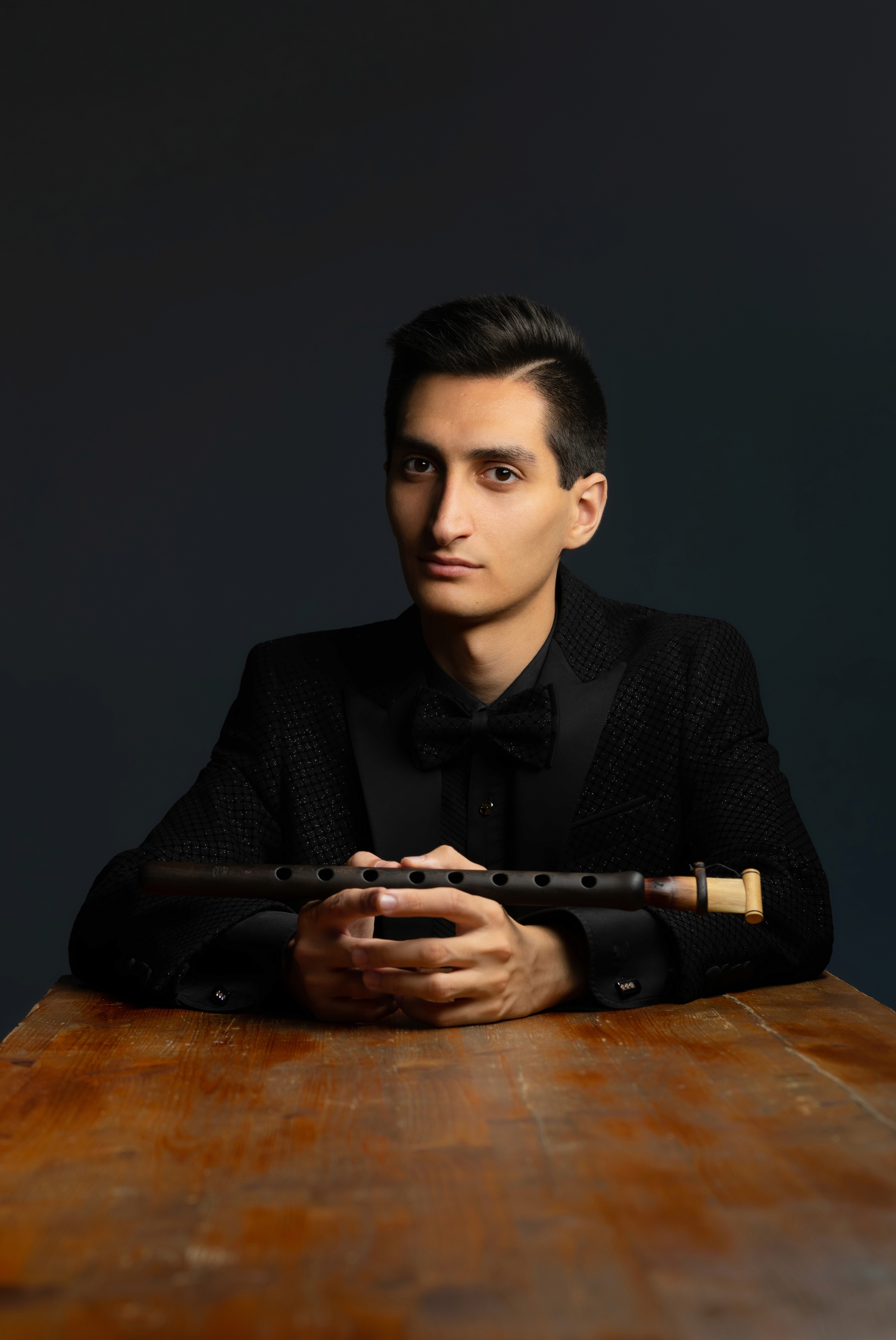 Erik Mirzoyan holding a duduk.