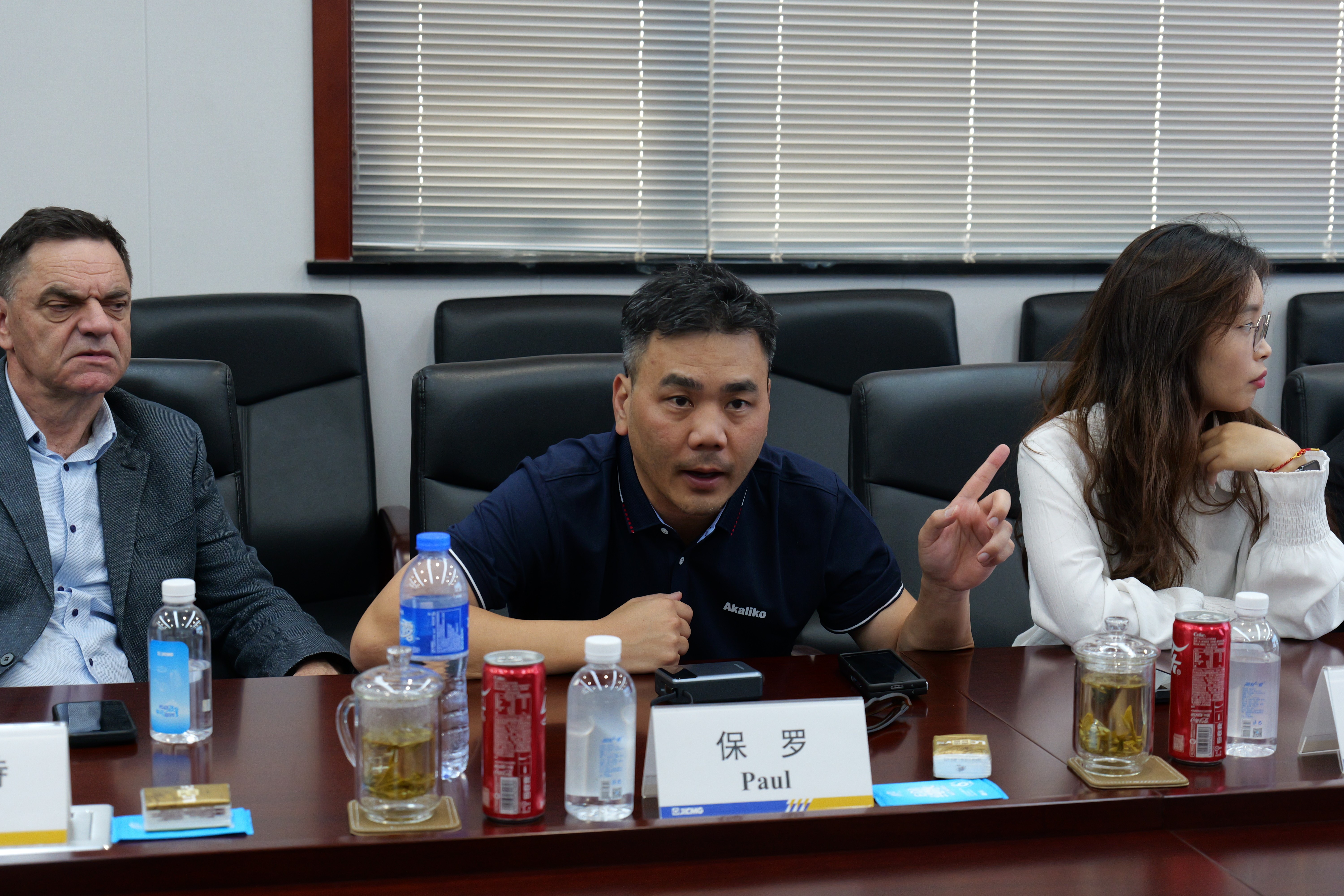Man carrying a package outside a building