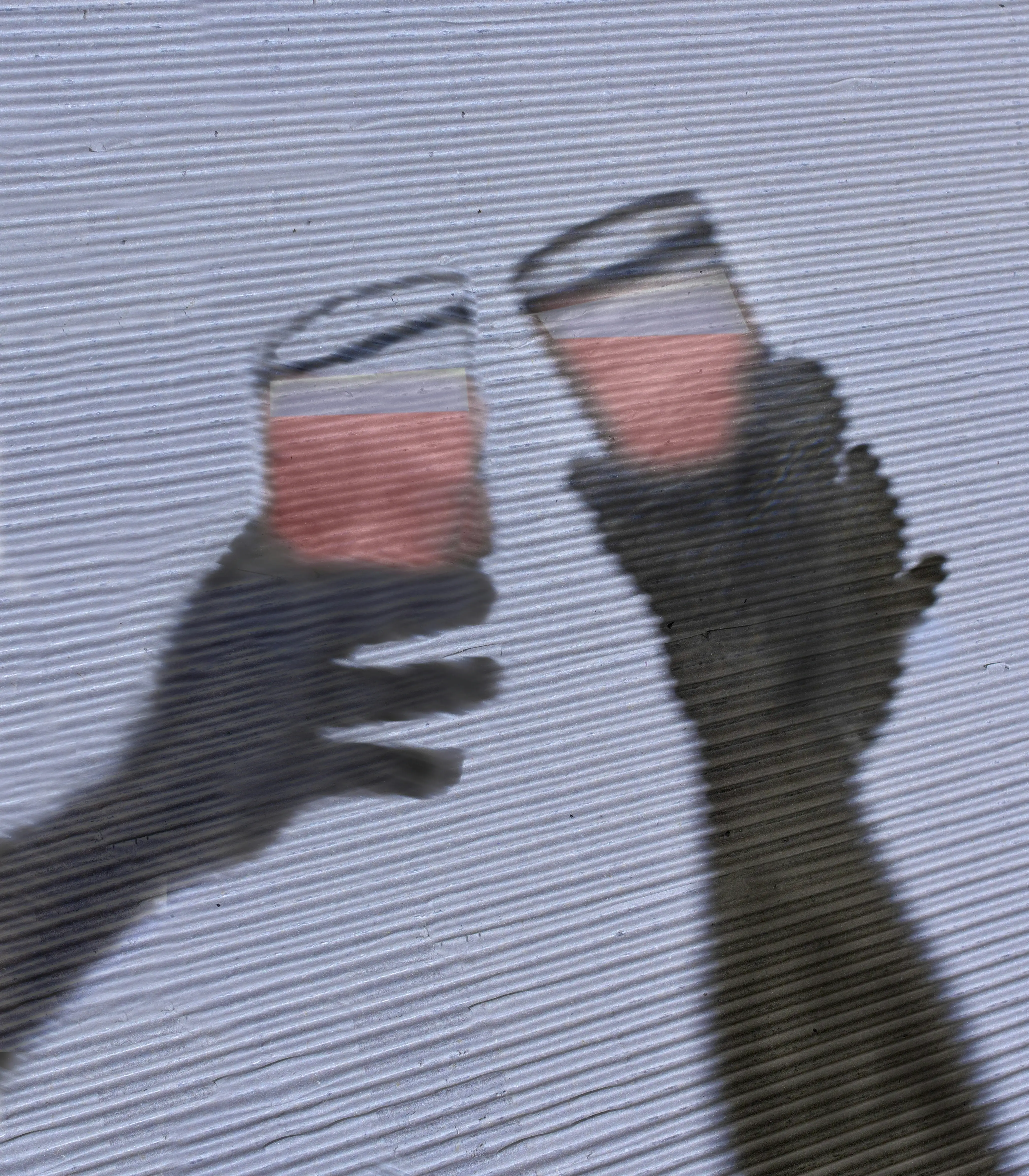 a person holding a glass with a liquid in it