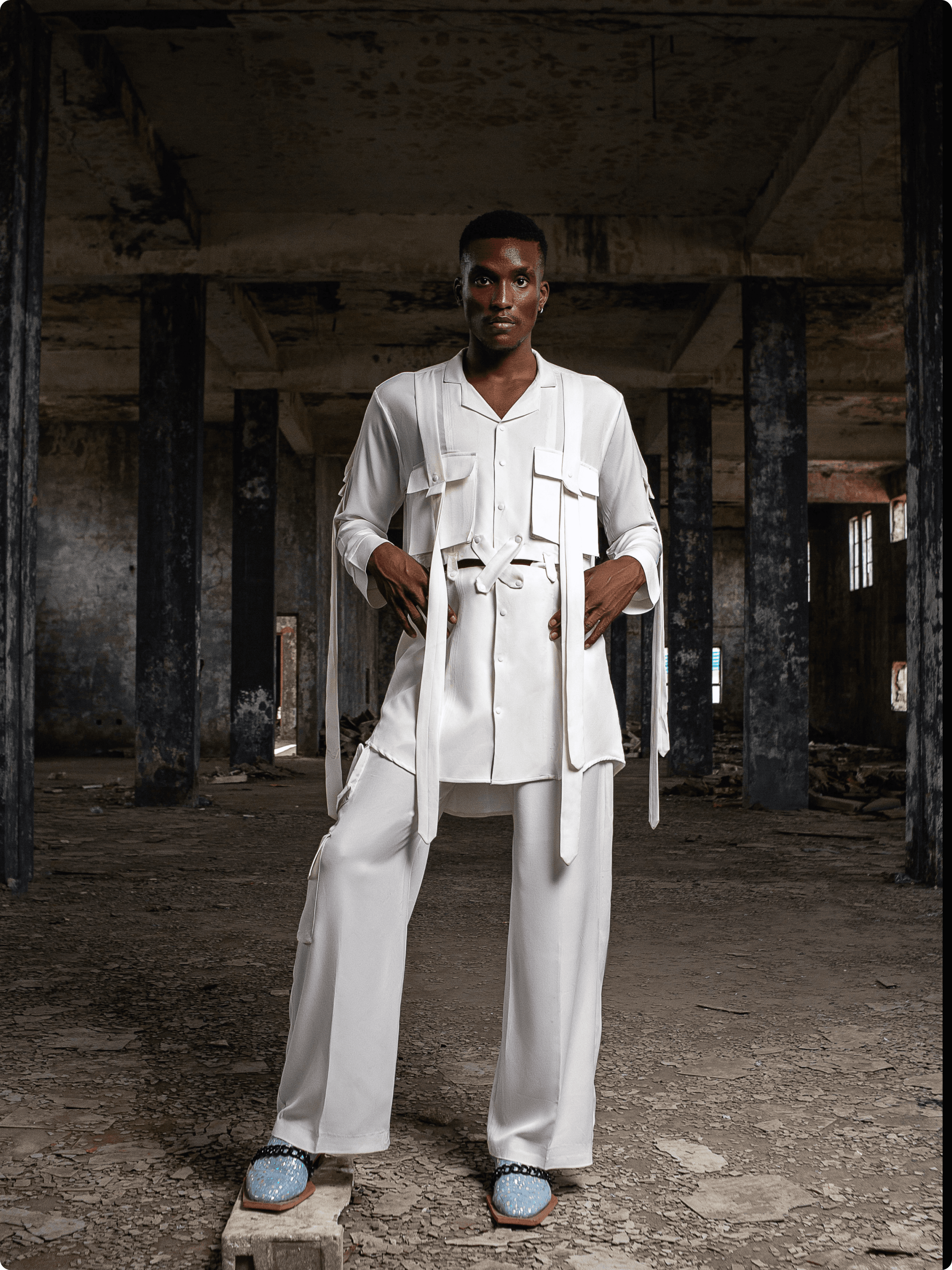 Black bucket hat floating against black, embroidered at the front with the distressed white Deadpan smiley face logo (X eyes, tongue out).
