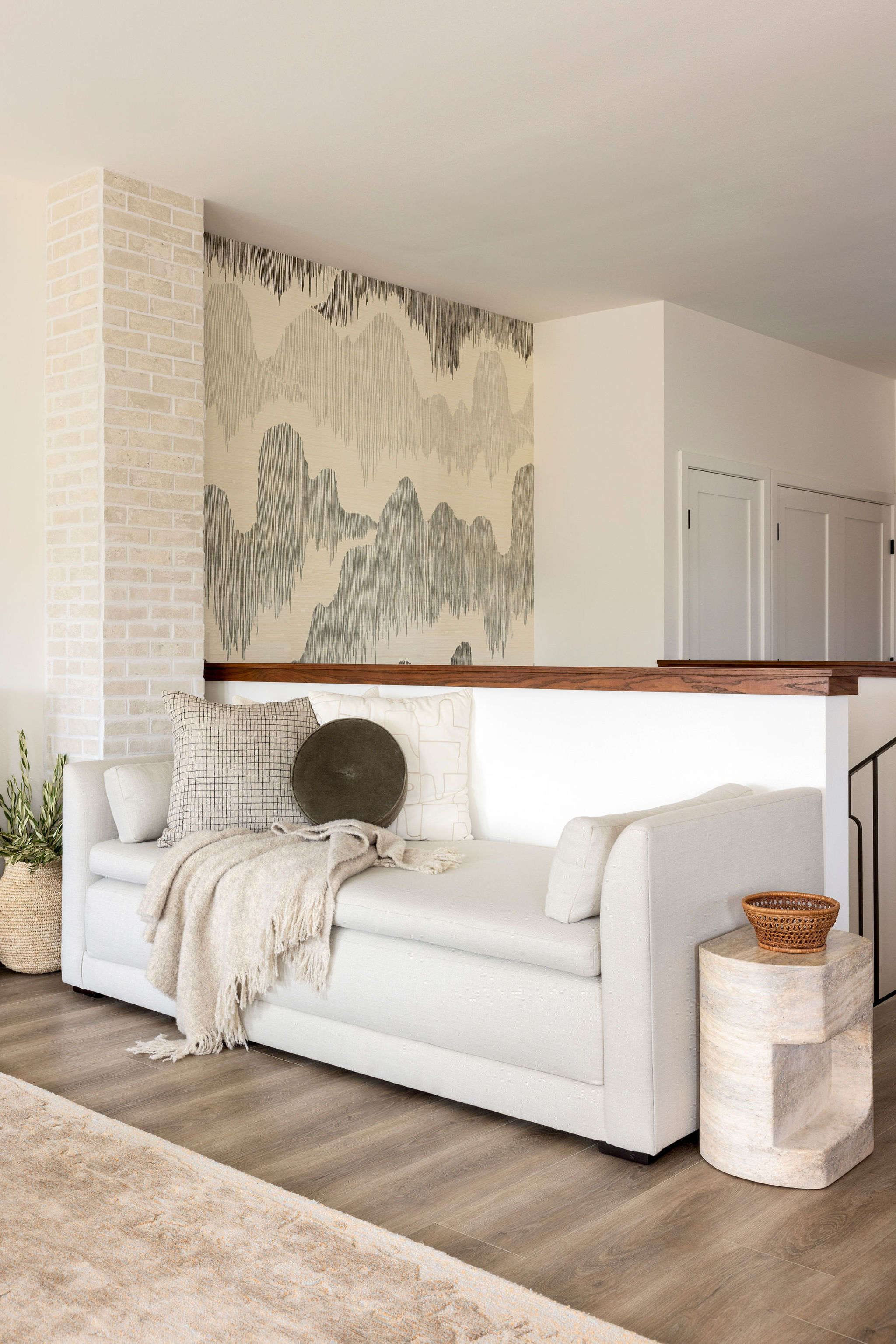 Serene living room daybed  styled with soft neutral cushions, a cozy throw, and natural textured accents, creating a relaxing nook.