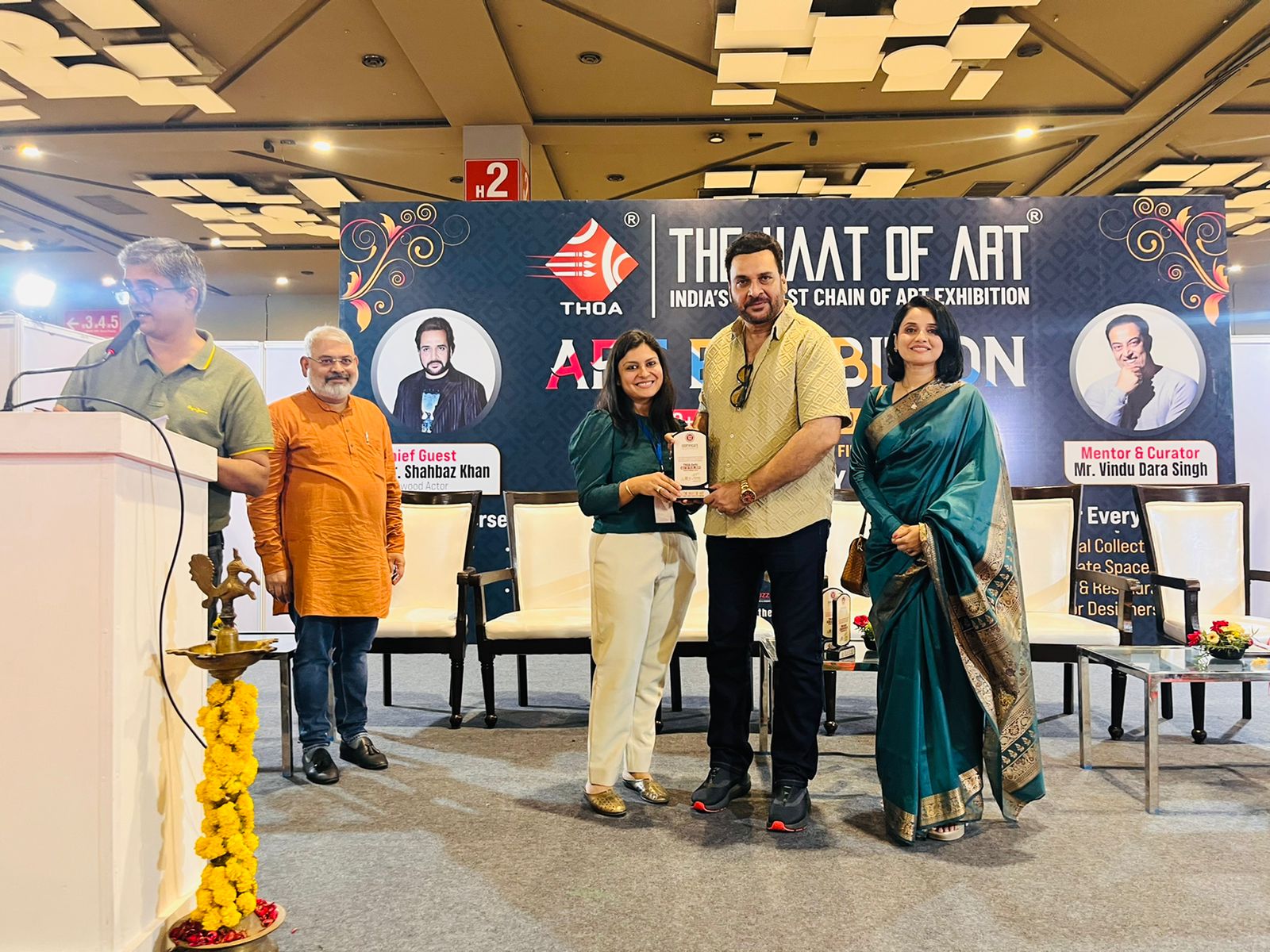 Chandni Kamboj, founder of the Creative Pod studio receiving an award at the Haat of Art exhibition.