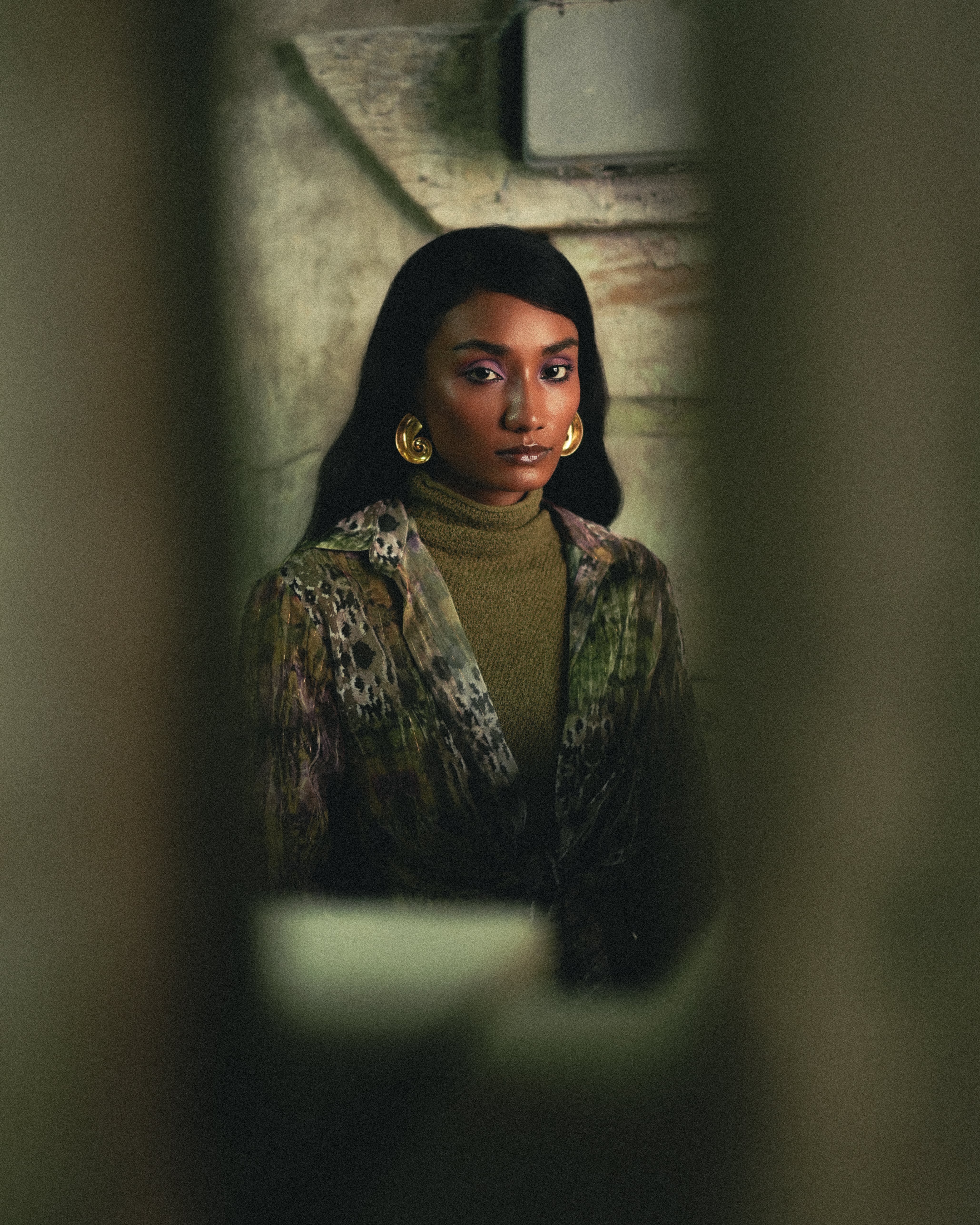 Group of friends smiling on a lively city street at night