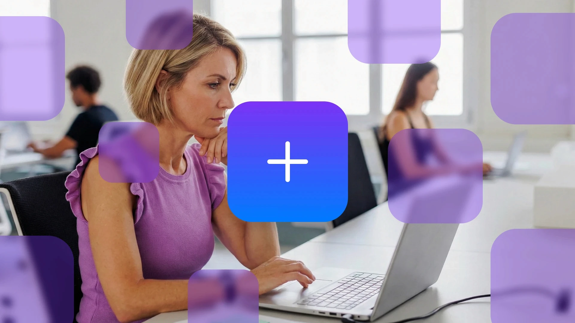 A focused professional working on a laptop in an office, surrounded by floating purple square overlays representing the overwhelming number of applications in a typical SMB. This visualizes what SaaS sprawl really looks like for small to medium-sized businesses.