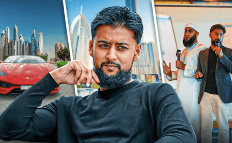 A man works on a laptop in an office.