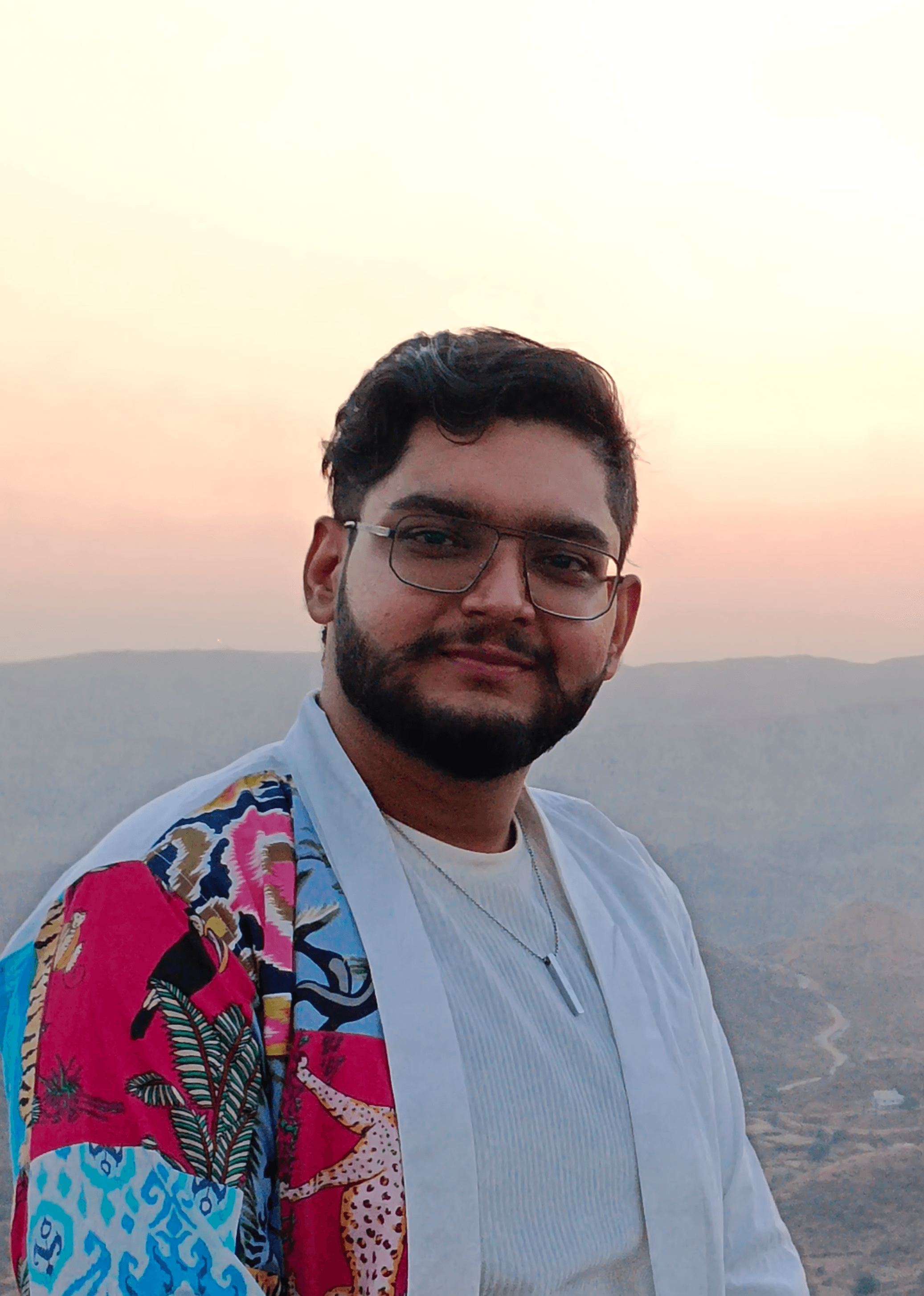 Black and white portrait of a man with a beard and glasses