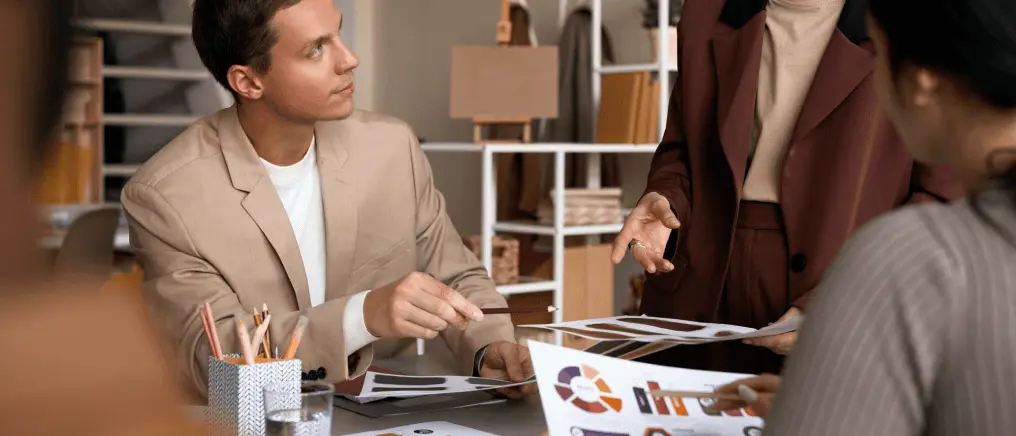 Designers discussing ideas and innovation during creative meeting