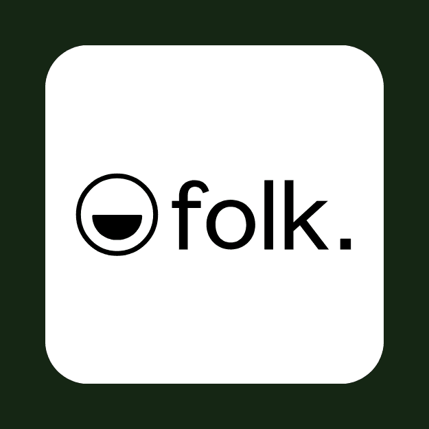 a white car parked in front of a building