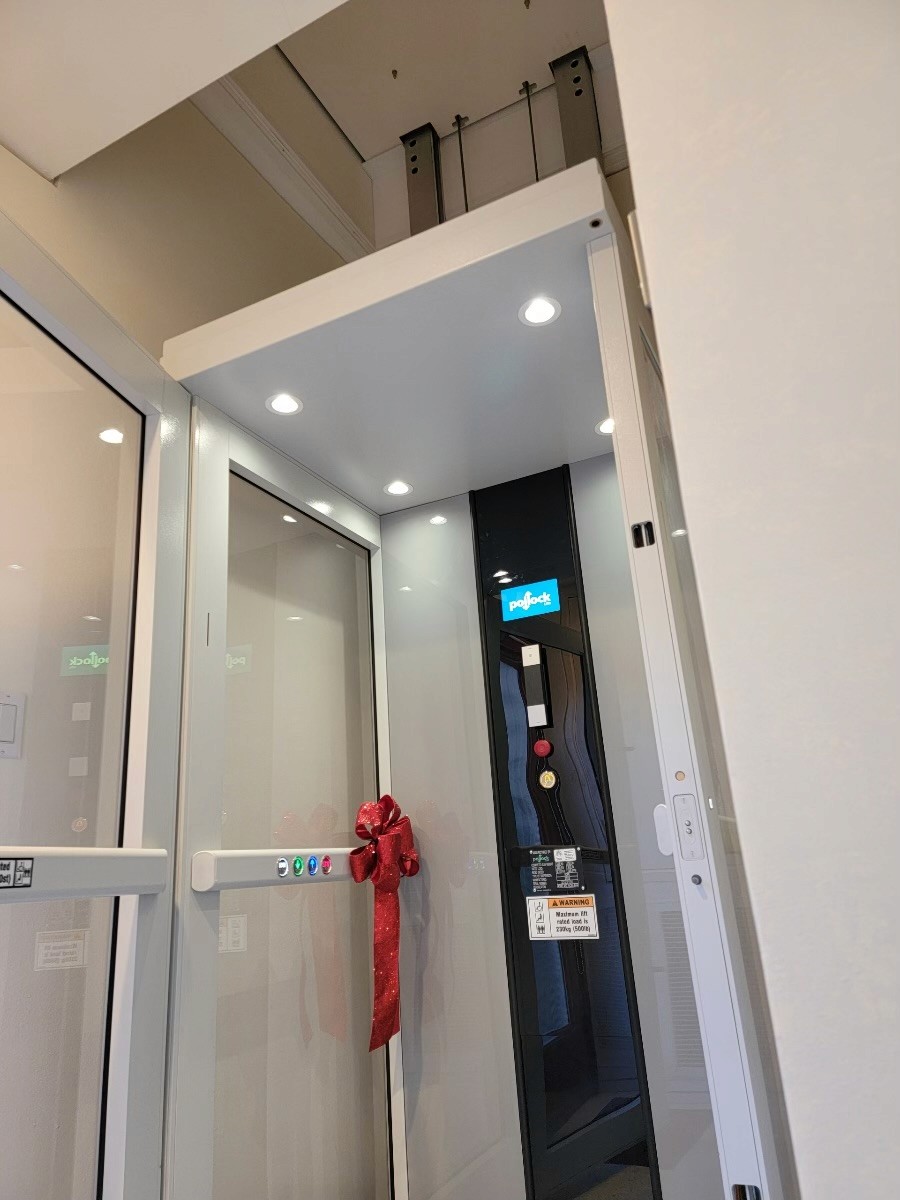 Through-the-floor home elevator installed where a spiral staircase used to be