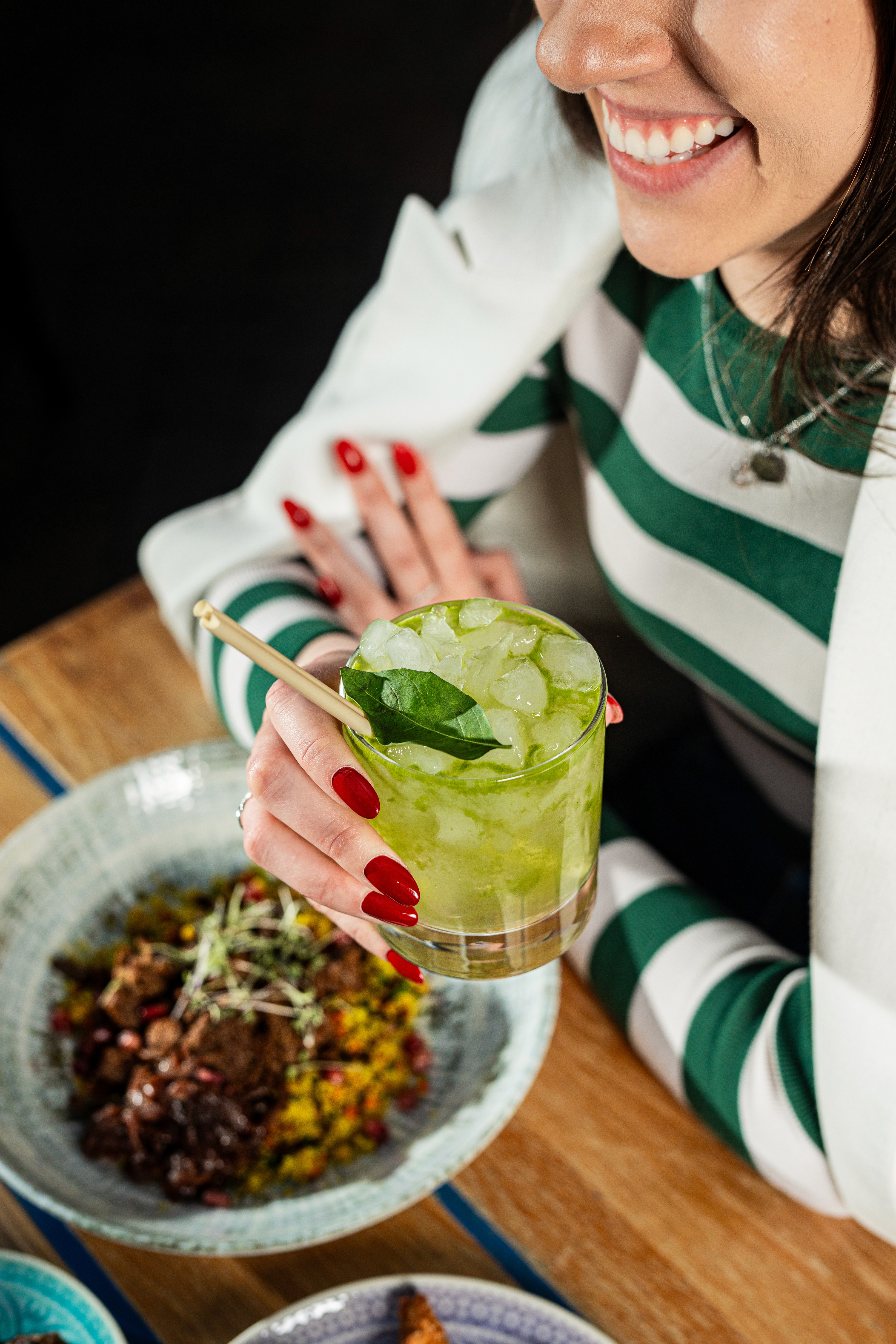 People sharing food at Mazeltov restaurant