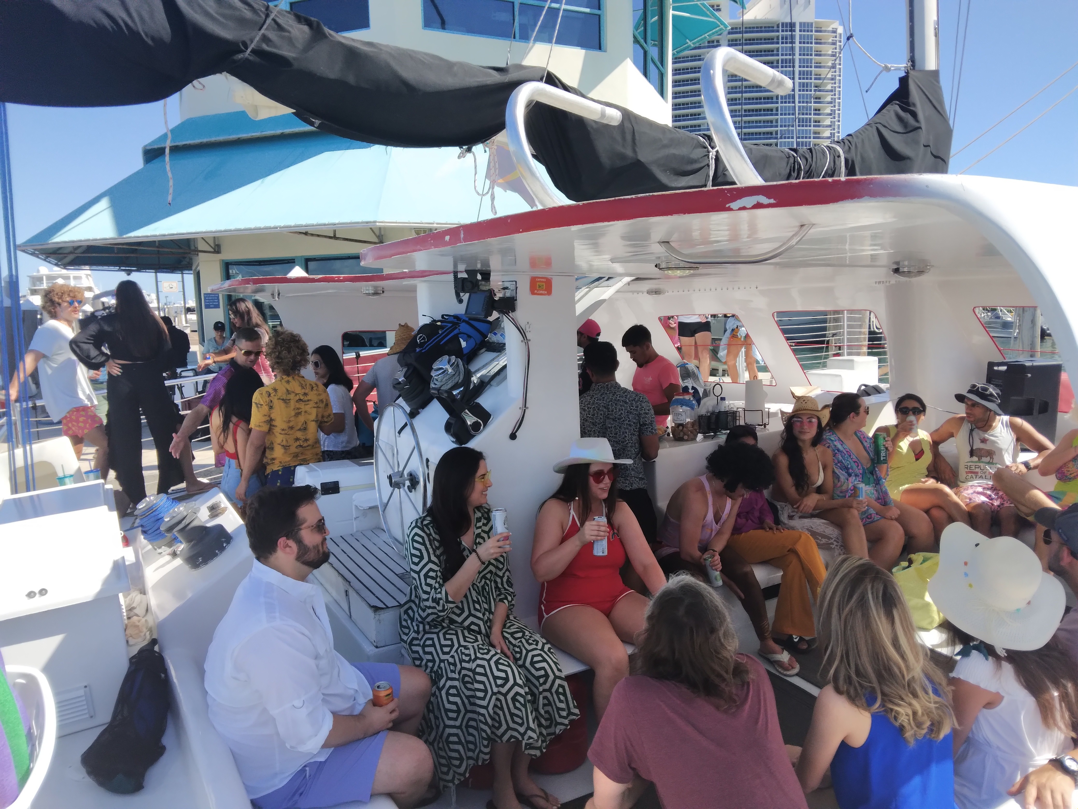 silhouette of man and woman holding fishing rod standing on dock during sunset
