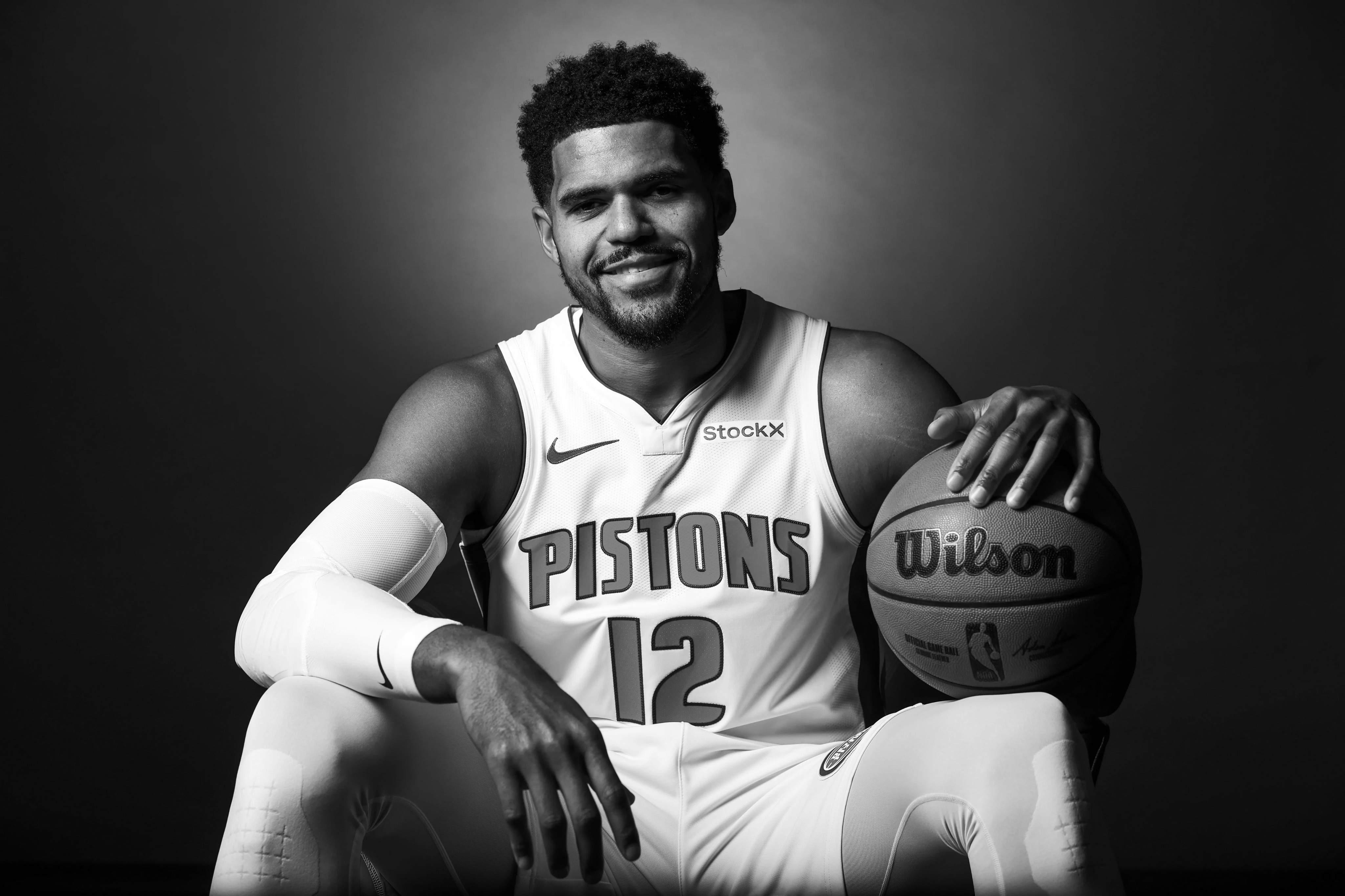 Elf woman in white dress raising hands by the river