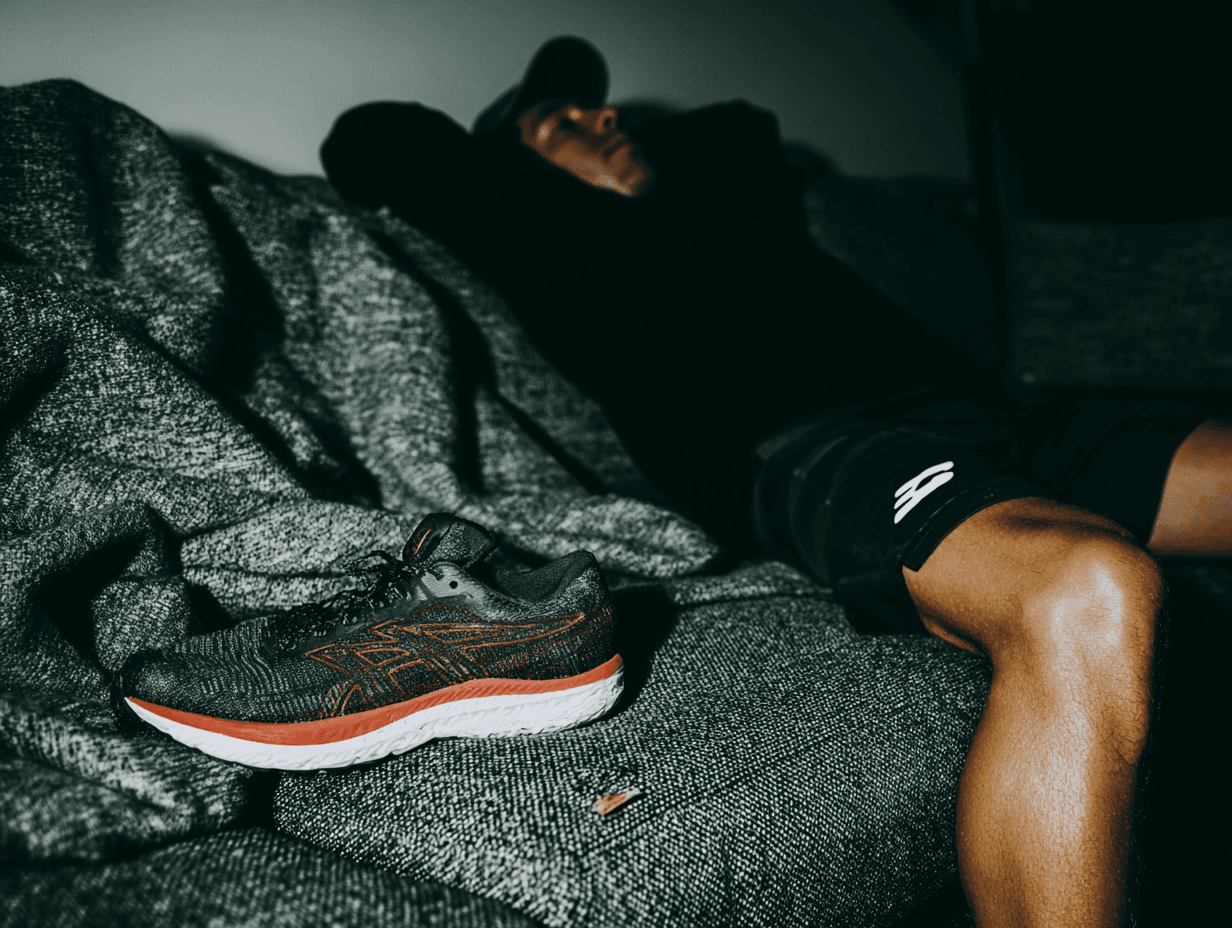 Runner sitting on a couch resting