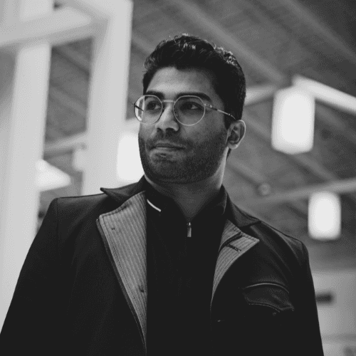Black and white photo of man posing on camera