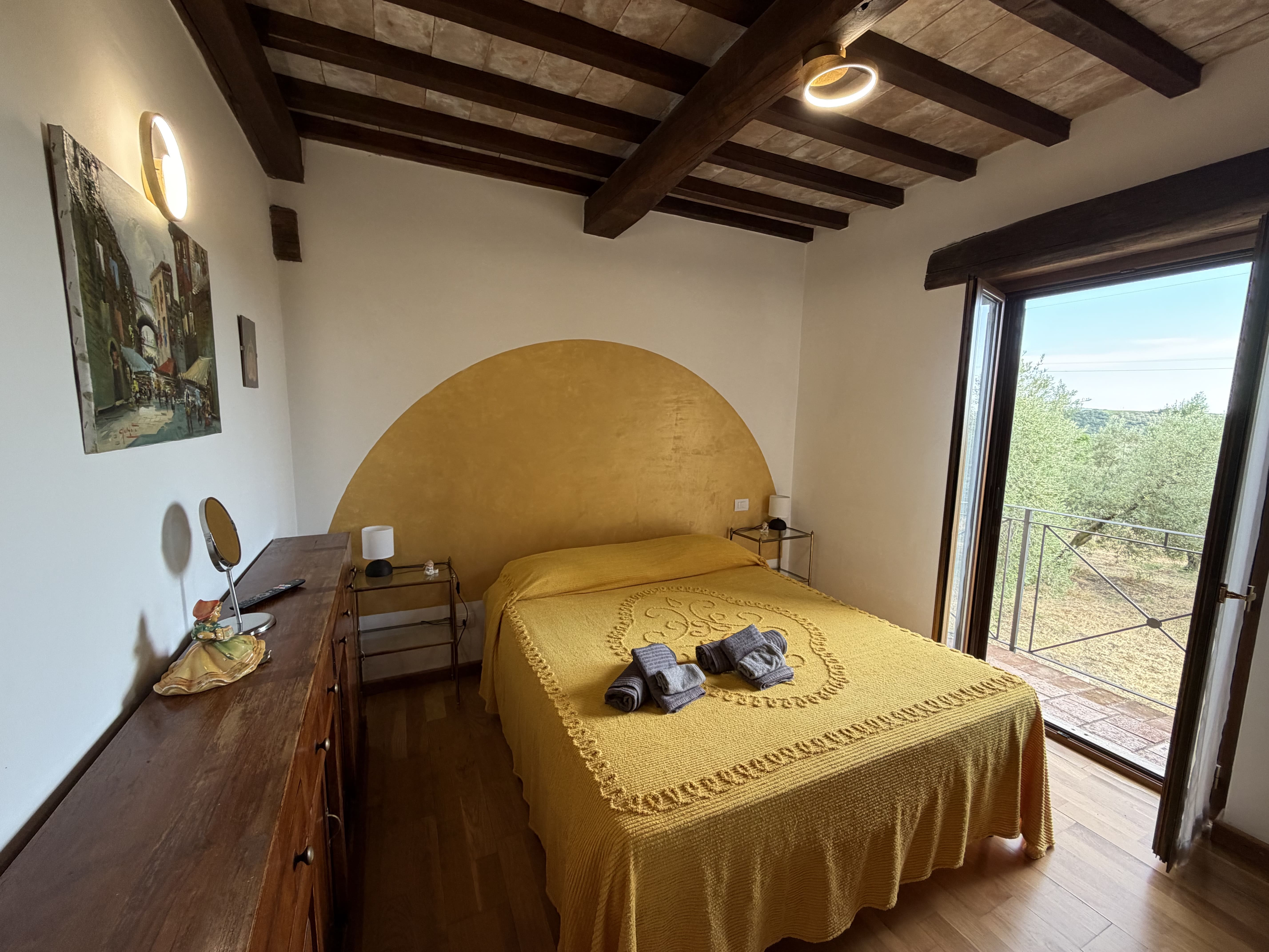 Bedroom overlooking the estate and the hills of the Tuscan Maremma