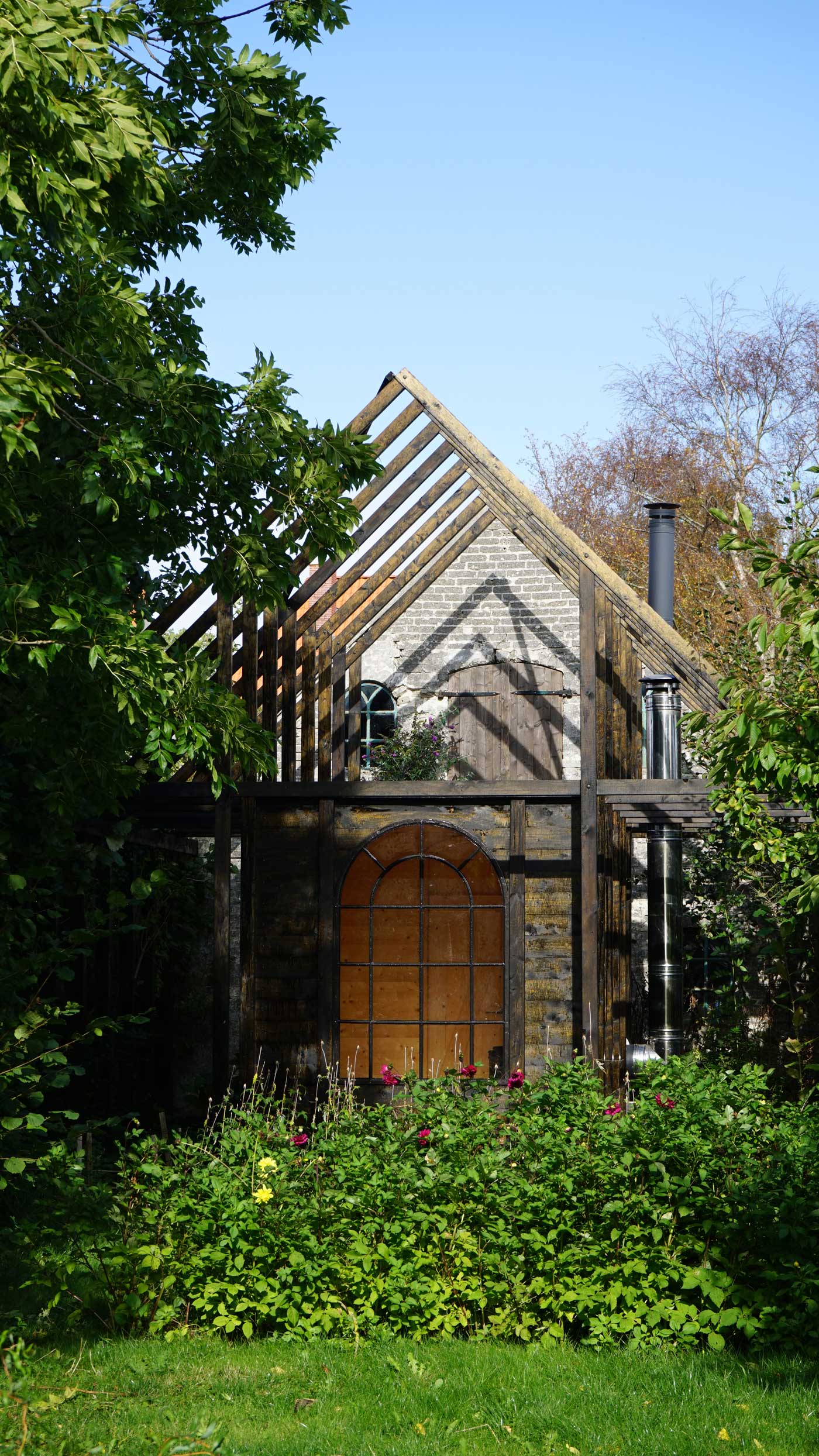 Bakkely Sauna and Guest House exterior with timber structure and garden setting on Ærø designed by Asger Risborg Jakobsen