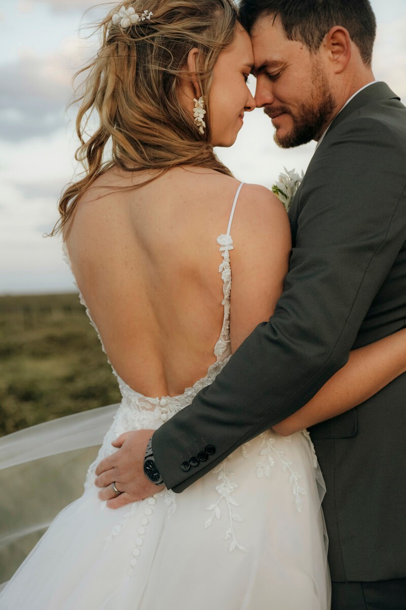 Intimate embrace between bride and groom at Lombardini wedding