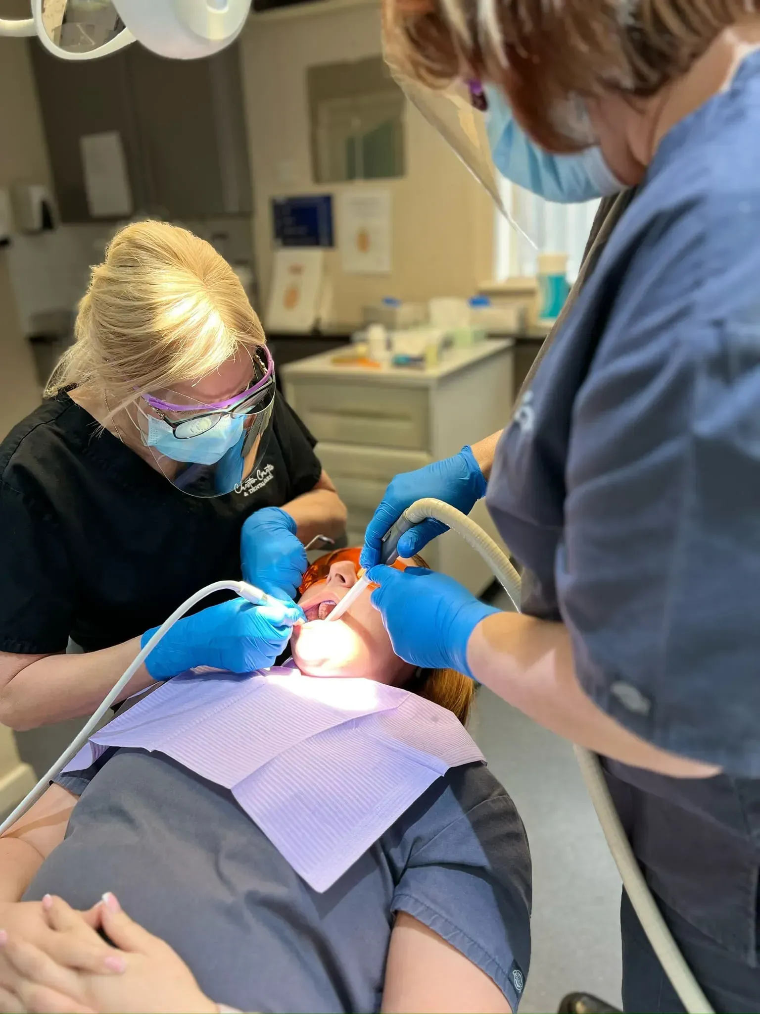 Our dentist in surgery doing some dental work on a patient