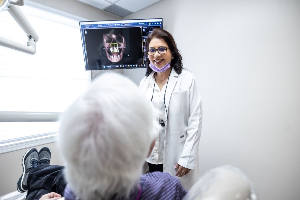 Dr. Navneet Rai discussing Dental Implants with Patient in Newark & Milltown NJ