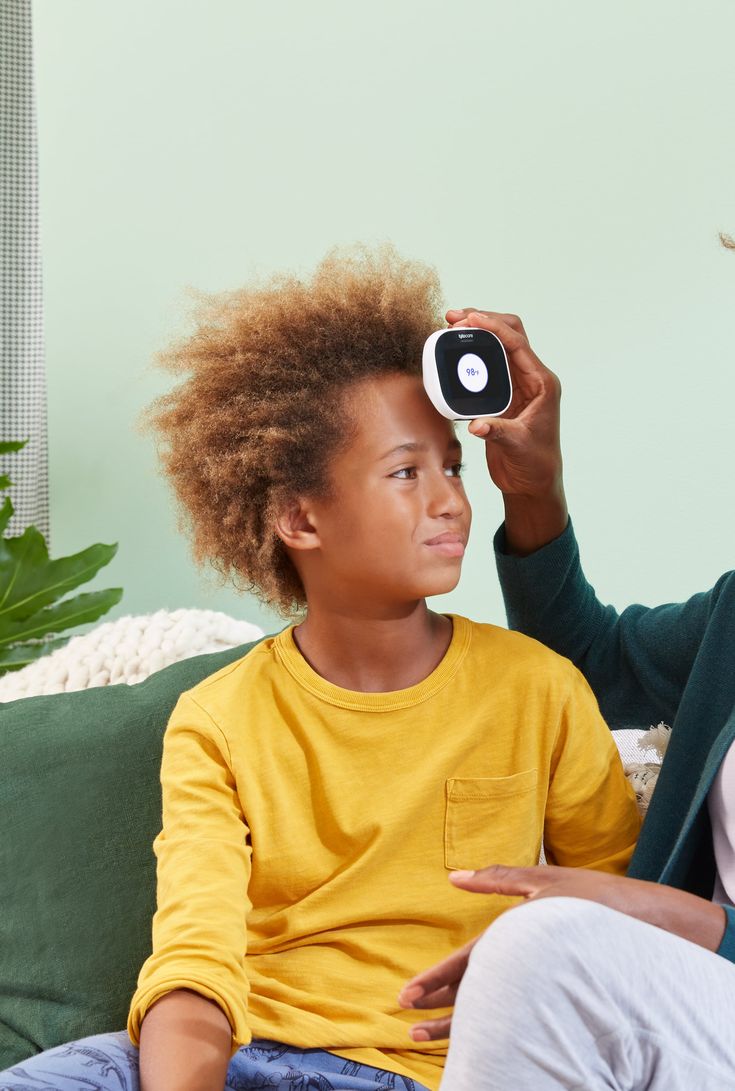 friendly female pediatrician touches shoulder teenage