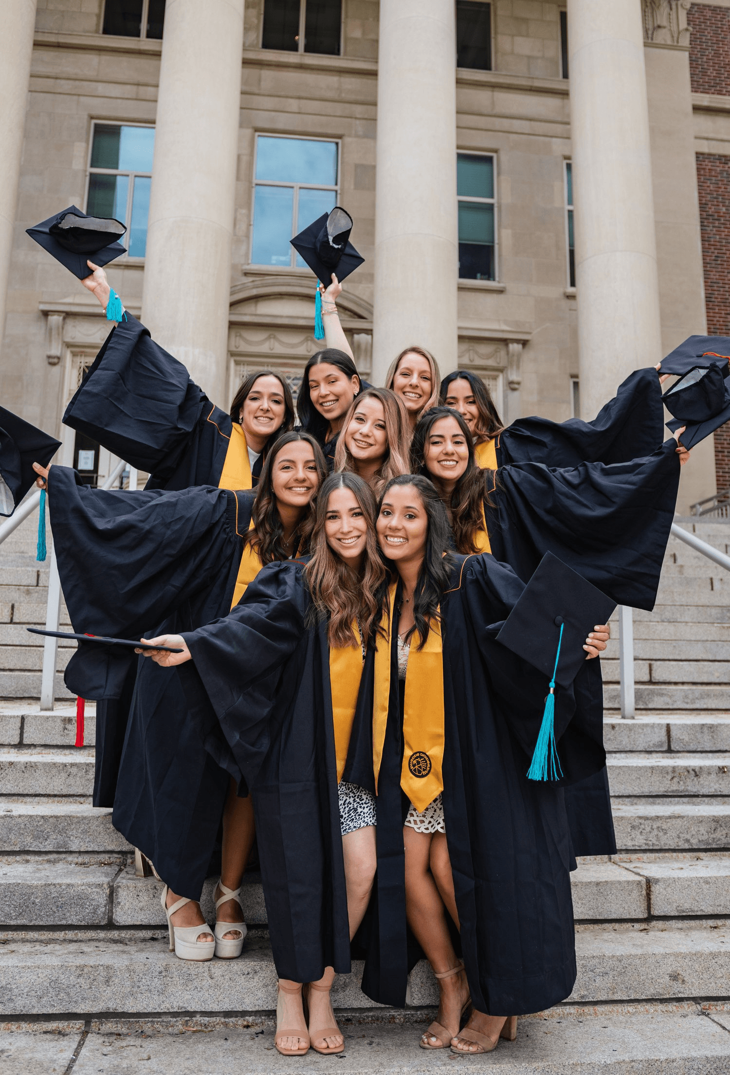 a group of graduating girls in the attire