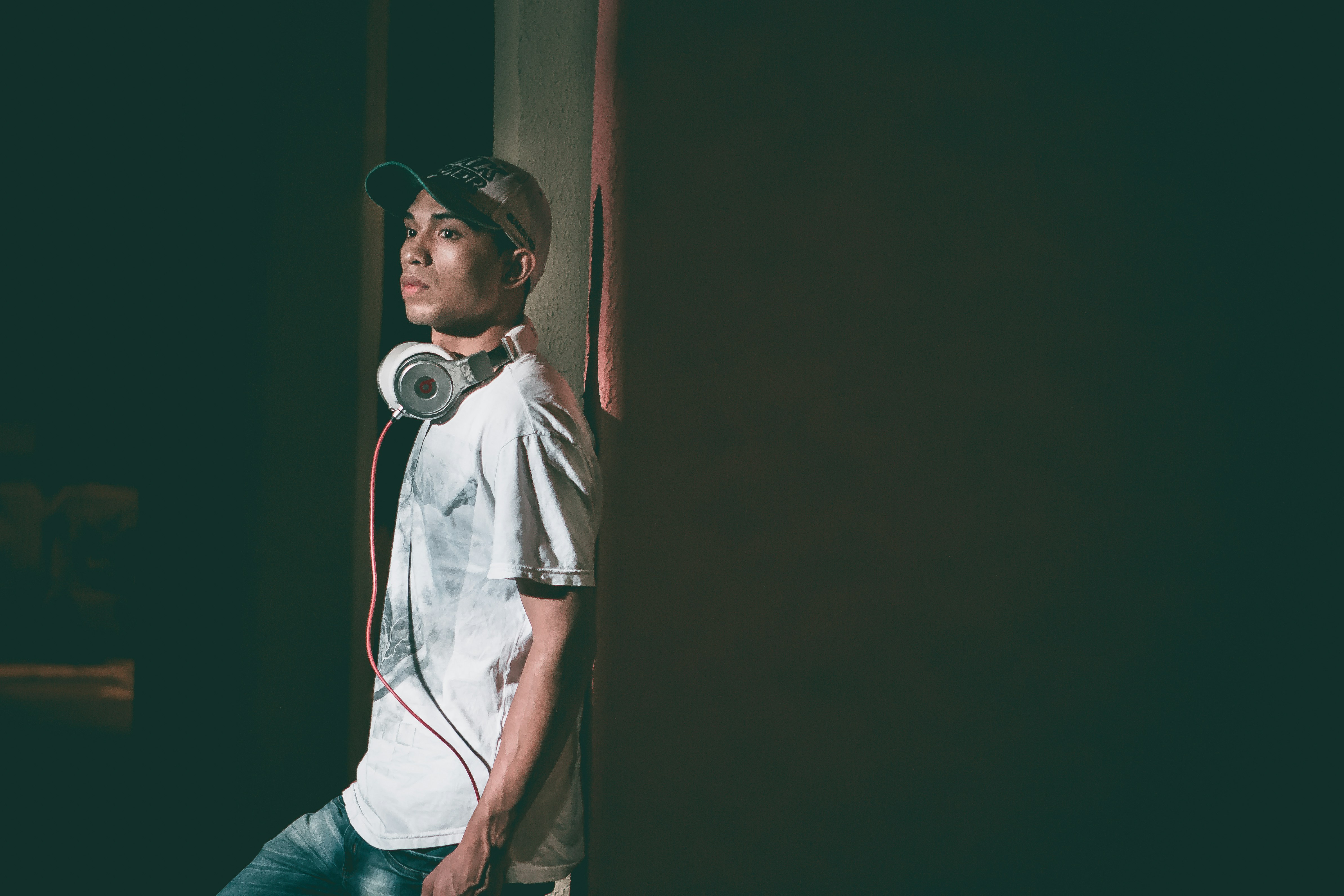 man standing  by wall - best apps to record music
