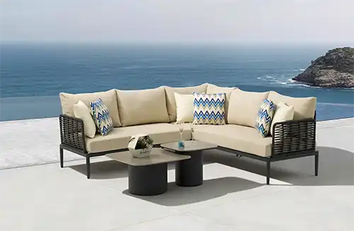 Outdoor garden furniture set from Bali COCO in a lush garden setting.